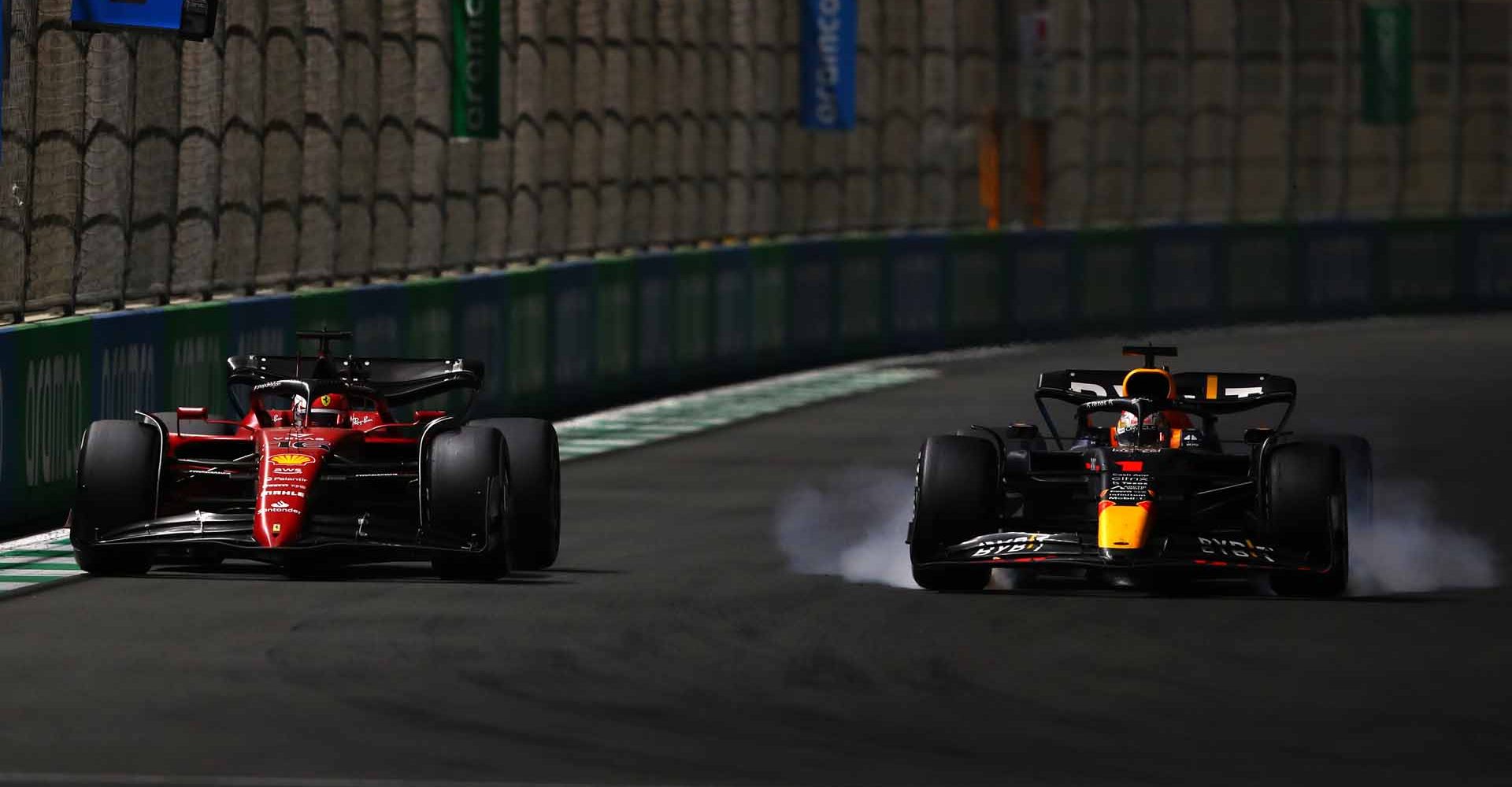 JEDDAH, SAUDI ARABIA - MARCH 27: Max Verstappen of the Netherlands driving the (1) Oracle Red Bull Racing RB18 and Charles Leclerc of Monaco driving (16) the Ferrari F1-75 battle for track position during the F1 Grand Prix of Saudi Arabia at the Jeddah Corniche Circuit on March 27, 2022 in Jeddah, Saudi Arabia. (Photo by Getty Images/Getty Images)