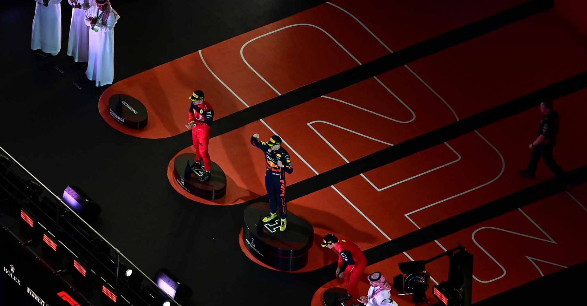 JEDDAH, SAUDI ARABIA - MARCH 27: Race winner Max Verstappen of the Netherlands and Oracle Red Bull Racing, Second placed Charles Leclerc of Monaco and Ferrari and Third placed Carlos Sainz of Spain and Ferrari on the podium during the F1 Grand Prix of Saudi Arabia at the Jeddah Corniche Circuit on March 27, 2022 in Jeddah, Saudi Arabia. (Photo by Clive Mason/Getty Images)