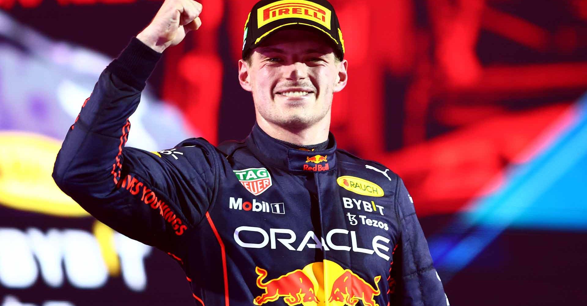 JEDDAH, SAUDI ARABIA - MARCH 27: Race winner Max Verstappen of the Netherlands and Oracle Red Bull Racing celebrates on the podium during the F1 Grand Prix of Saudi Arabia at the Jeddah Corniche Circuit on March 27, 2022 in Jeddah, Saudi Arabia. (Photo by Mark Thompson/Getty Images)