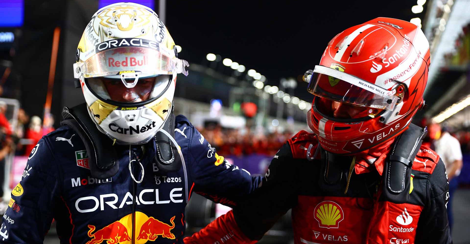 JEDDAH, SAUDI ARABIA - MARCH 27: Race winner Max Verstappen of the Netherlands and Oracle Red Bull Racing and Second placed Charles Leclerc of Monaco and Ferrari talk in parc ferme during the F1 Grand Prix of Saudi Arabia at the Jeddah Corniche Circuit on March 27, 2022 in Jeddah, Saudi Arabia. (Photo by Mark Thompson/Getty Images)