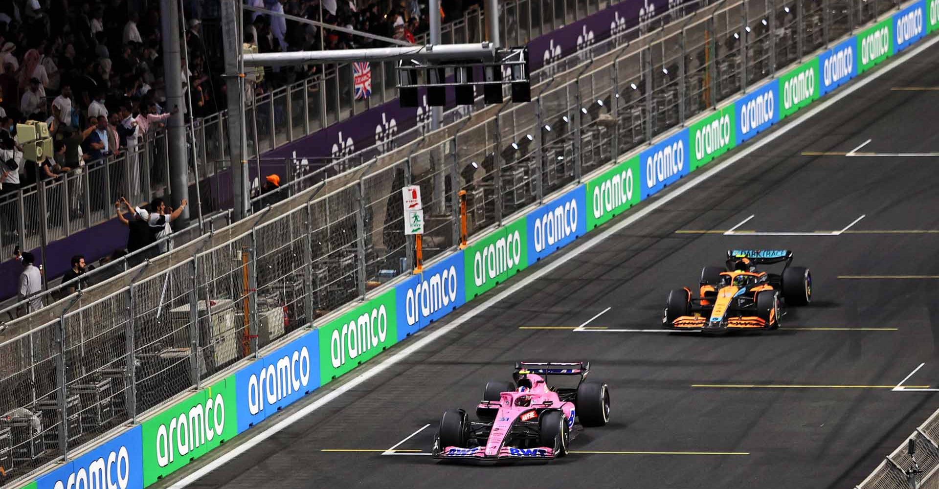 Esteban Ocon (FRA) Alpine F1 Team A522 and Lando Norris (GBR) McLaren MCL36 battle for position.  Saudi Arabian Grand Prix, Sunday 27th March 2022. Jeddah, Saudi Arabia.