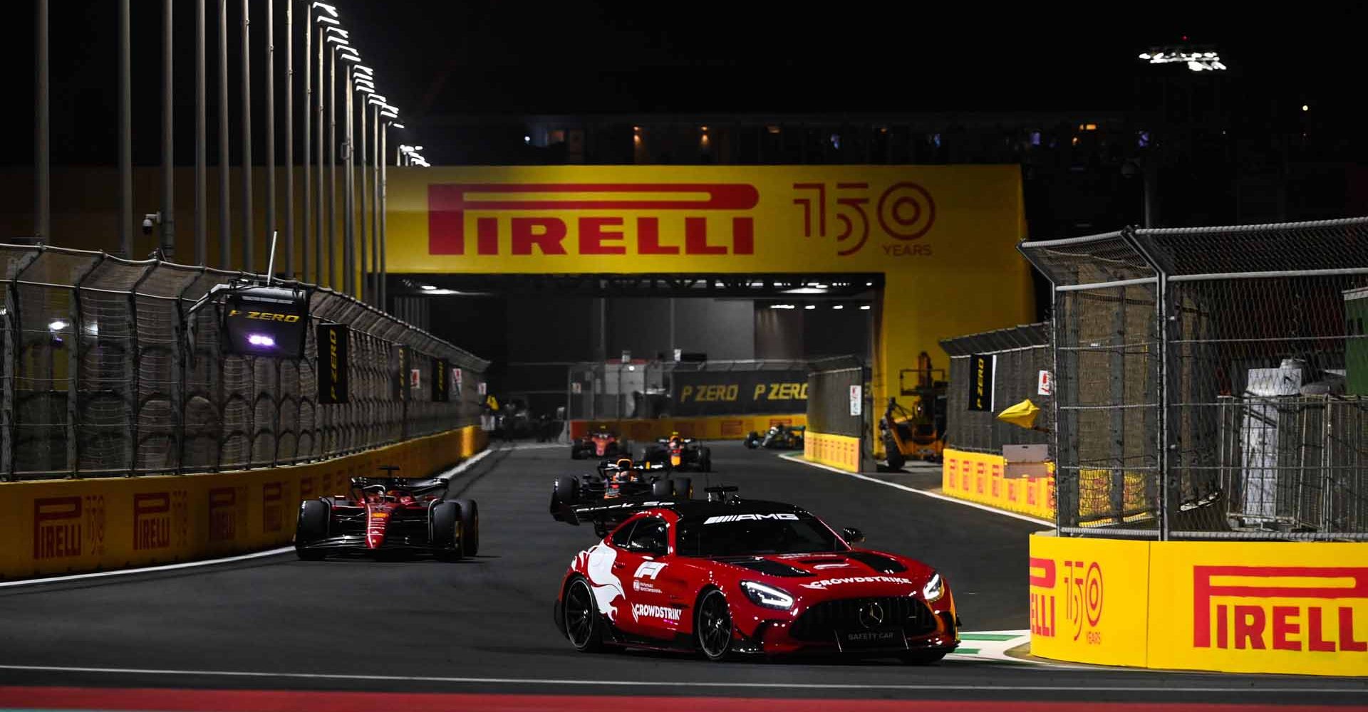 JEDDAH STREET CIRCUIT, SAUDI ARABIA - MARCH 27: The Safety Car leads Charles Leclerc, Ferrari F1-75, and Max Verstappen, Red Bull Racing RB18 during the Saudi Arabian GP at Jeddah Street Circuit on Sunday March 27, 2022 in Jeddah, Saudi Arabia. (Photo by Mark Sutton / LAT Images)