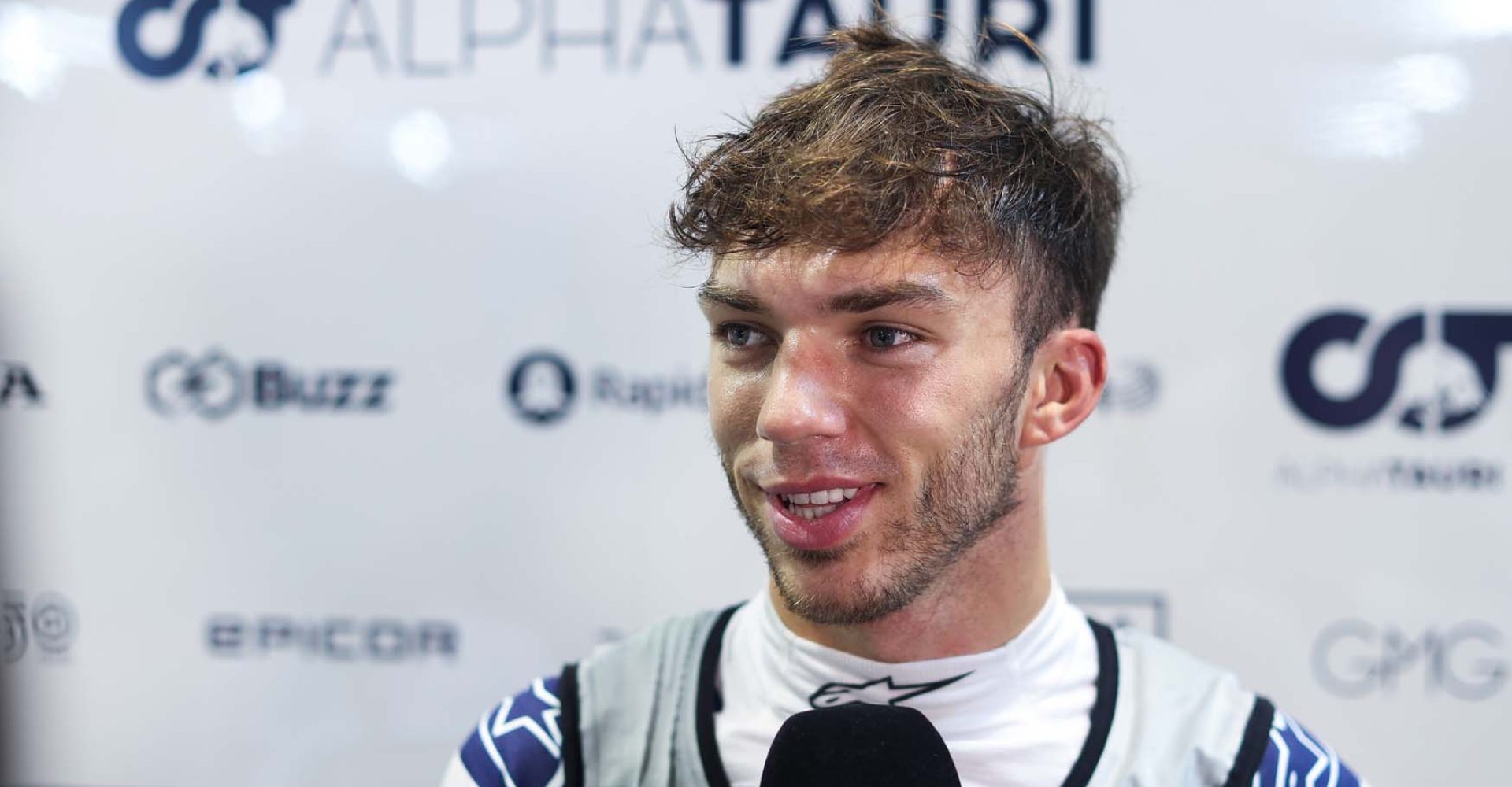 SINGAPORE, SINGAPORE - SEPTEMBER 30: Pierre Gasly of France and Scuderia AlphaTauri talks to the media in the Paddock after practice ahead of the F1 Grand Prix of Singapore at Marina Bay Street Circuit on September 30, 2022 in Singapore, Singapore. (Photo by Peter Fox/Getty Images,)