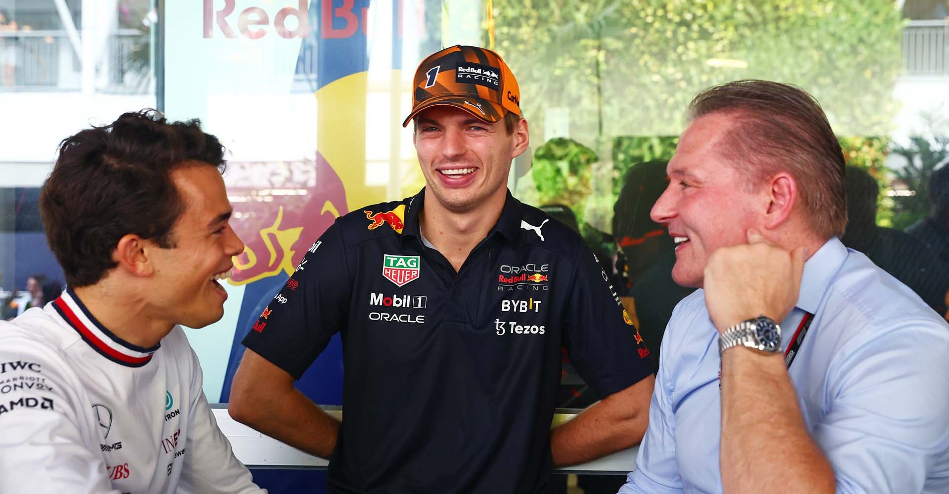 SINGAPORE, SINGAPORE - OCTOBER 02: Nyck de Vries of Netherlands, Mercedes Test and Reserve Driver, Max Verstappen of the Netherlands and Oracle Red Bull Racing and Jos Verstappen talk in the Paddock prior to the F1 Grand Prix of Singapore at Marina Bay Street Circuit on October 02, 2022 in Singapore, Singapore. (Photo by Mark Thompson/Getty Images,)