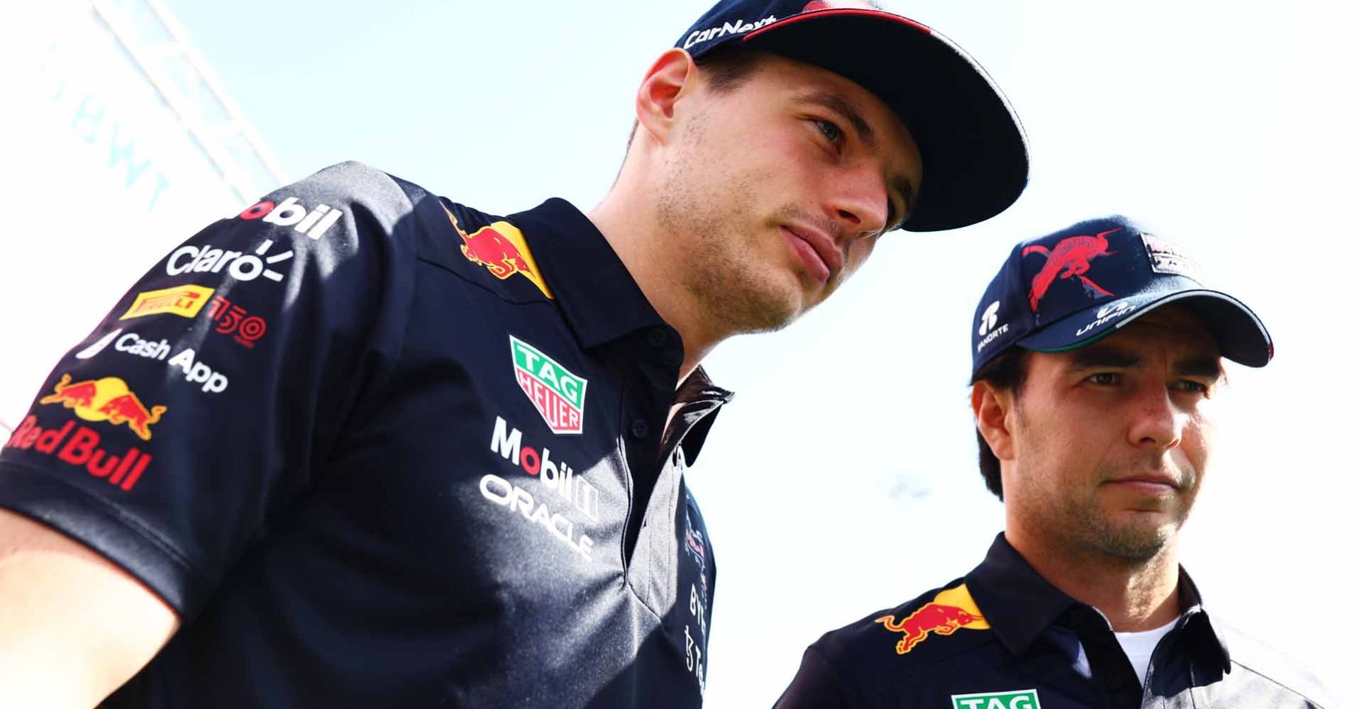 BARCELONA, SPAIN - MAY 21: Max Verstappen of the Netherlands and Oracle Red Bull Racing and Sergio Perez of Mexico and Oracle Red Bull Racing talk in the Paddock prior to practice ahead of the F1 Grand Prix of Spain at Circuit de Barcelona-Catalunya on May 21, 2022 in Barcelona, Spain. (Photo by Mark Thompson/Getty Images)