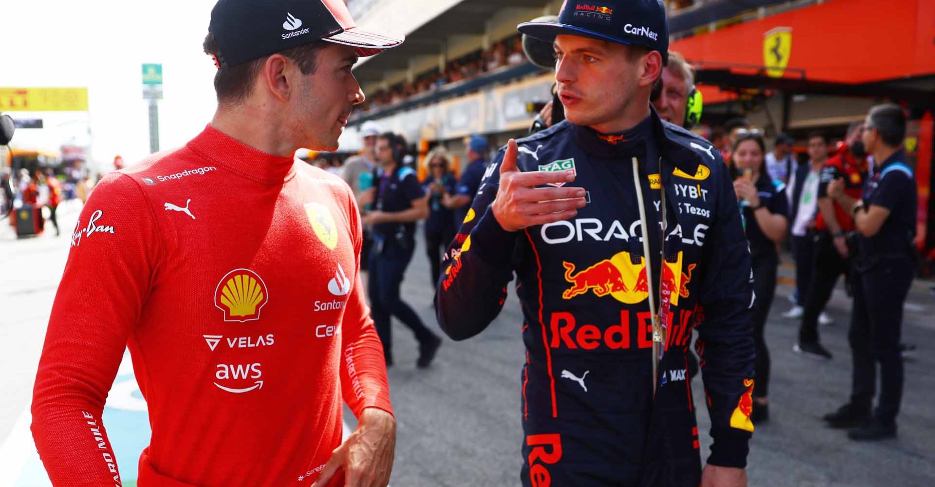 BARCELONA, SPAIN - MAY 21: Pole position qualifier Charles Leclerc of Monaco and Ferrari and Second placed qualifier Max Verstappen of the Netherlands and Oracle Red Bull Racing talk in parc ferme during qualifying ahead of the F1 Grand Prix of Spain at Circuit de Barcelona-Catalunya on May 21, 2022 in Barcelona, Spain. (Photo by Mark Thompson/Getty Images)