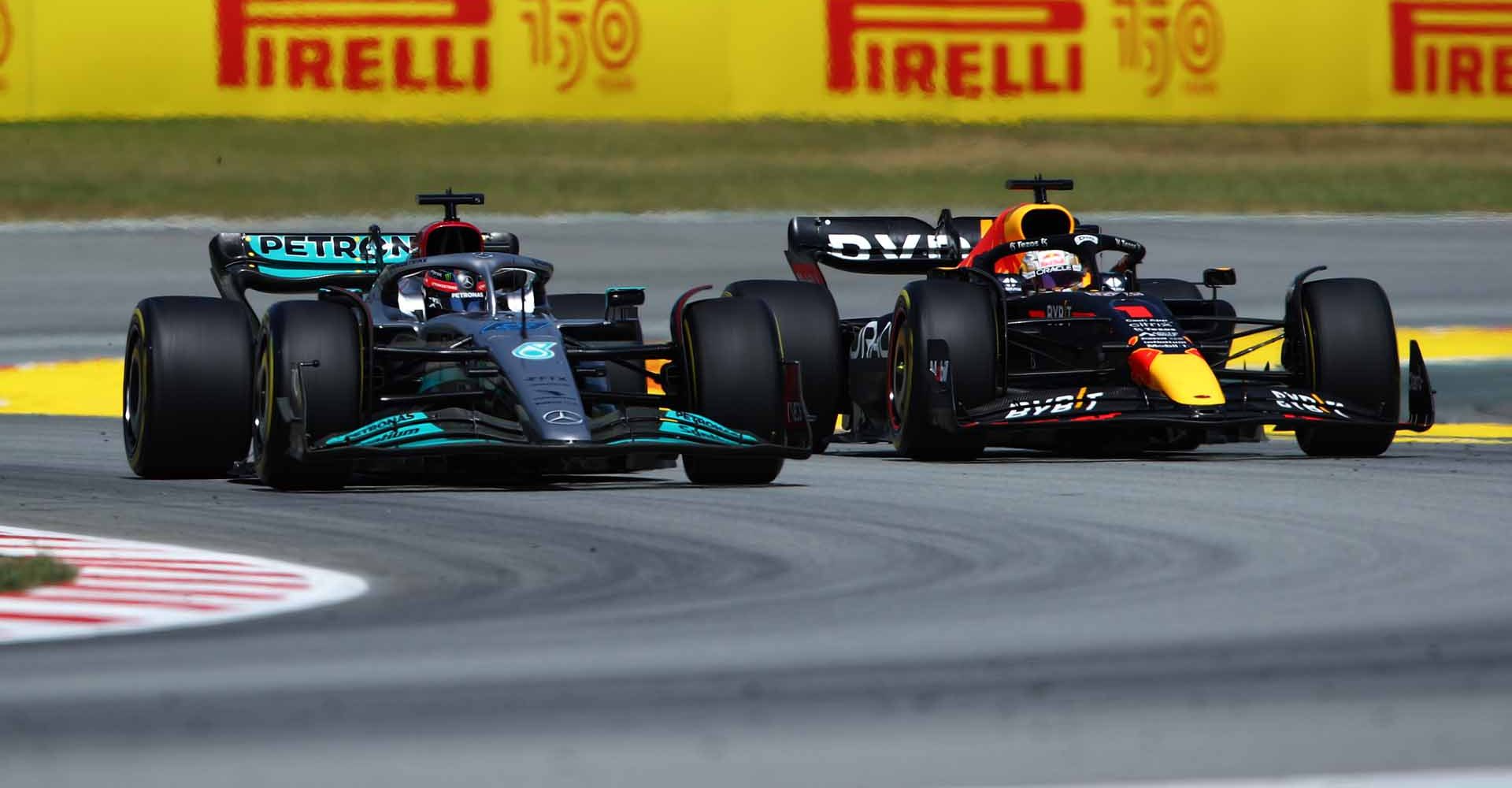 BARCELONA, SPAIN - MAY 22: George Russell of Great Britain driving the (63) Mercedes AMG Petronas F1 Team W13 and Max Verstappen of the Netherlands driving the (1) Oracle Red Bull Racing RB18 battle for track position during the F1 Grand Prix of Spain at Circuit de Barcelona-Catalunya on May 22, 2022 in Barcelona, Spain. (Photo by Getty Images/Getty Images)