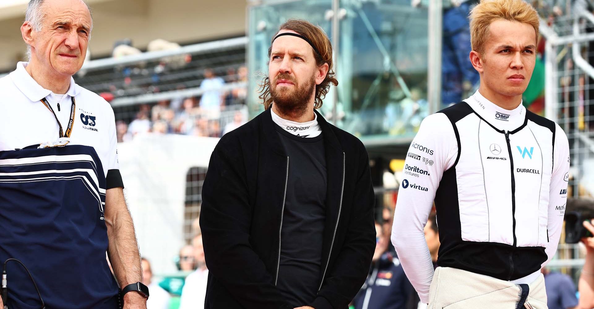 AUSTIN, TEXAS - OCTOBER 23: Scuderia AlphaTauri Team Principal Franz Tost, Sebastian Vettel of Germany and Aston Martin F1 Team and Alexander Albon of Thailand and Williams stand in tribute to the late Dietrich Mateschitz on the grid during the F1 Grand Prix of USA at Circuit of The Americas on October 23, 2022 in Austin, Texas. (Photo by Mark Thompson/Getty Images)