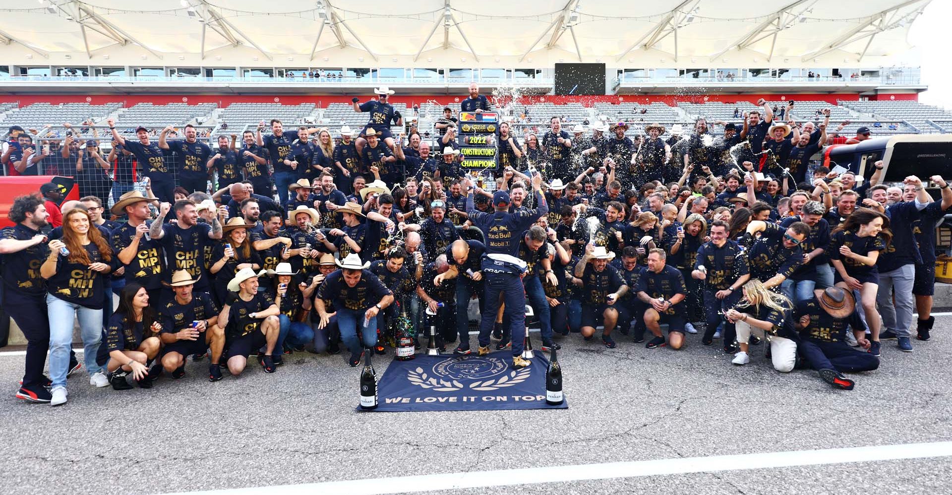 AUSTIN, TEXAS - OCTOBER 23: Race winner Max Verstappen of the Netherlands and Oracle Red Bull Racing celebrates winning the F1 World Constructors Championship with his team after the F1 Grand Prix of USA at Circuit of The Americas on October 23, 2022 in Austin, Texas. (Photo by Mark Thompson/Getty Images)