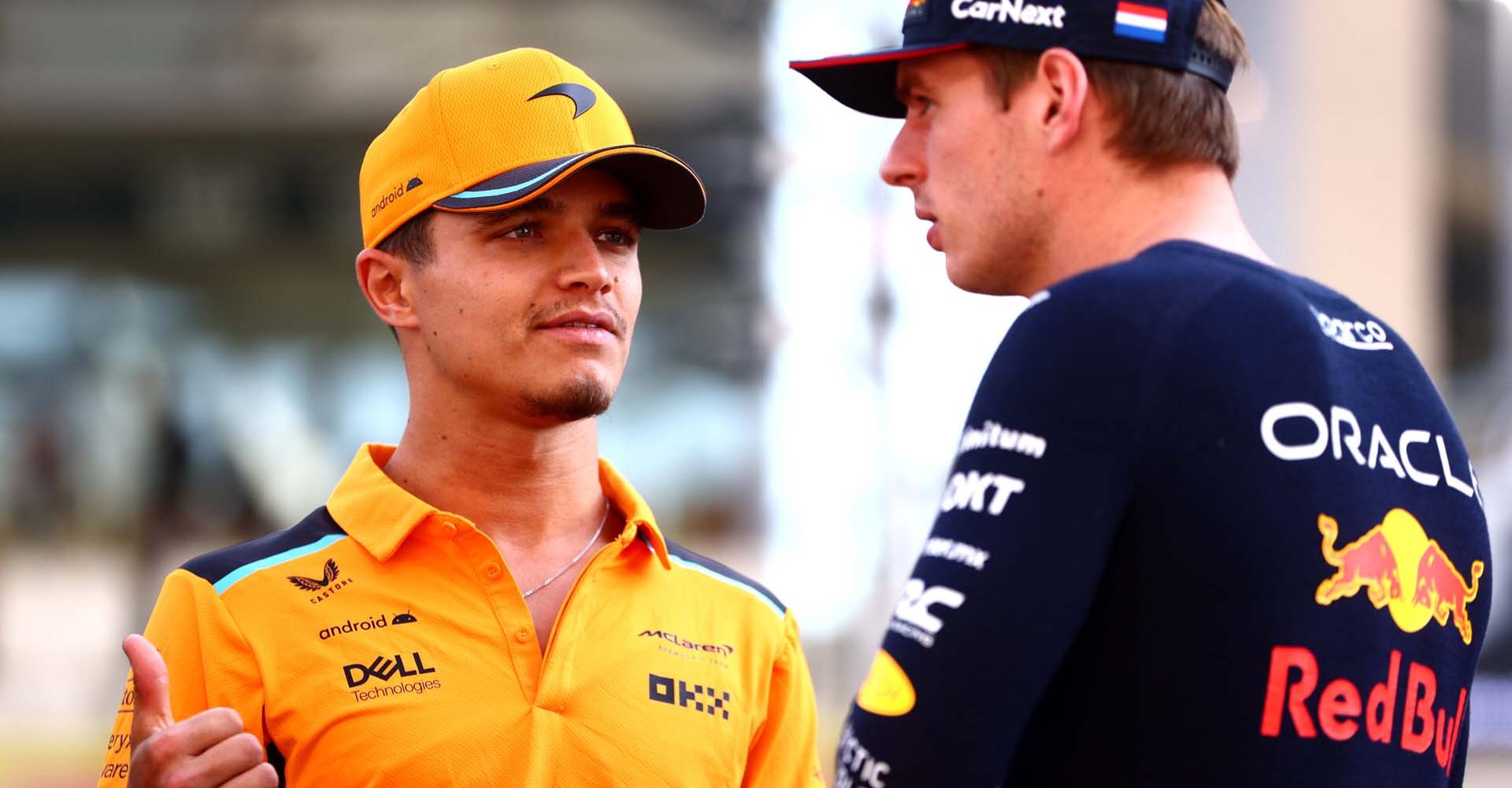 ABU DHABI, UNITED ARAB EMIRATES - NOVEMBER 26: Lando Norris of Great Britain and McLaren and Max Verstappen of the Netherlands and Oracle Red Bull Racing talk on the drivers parade prior to the F1 Grand Prix of Abu Dhabi at Yas Marina Circuit on November 26, 2023 in Abu Dhabi, United Arab Emirates. (Photo by Clive Rose/Getty Images) // Getty Images / Red Bull Content Pool // SI202311260071 // Usage for editorial use only //