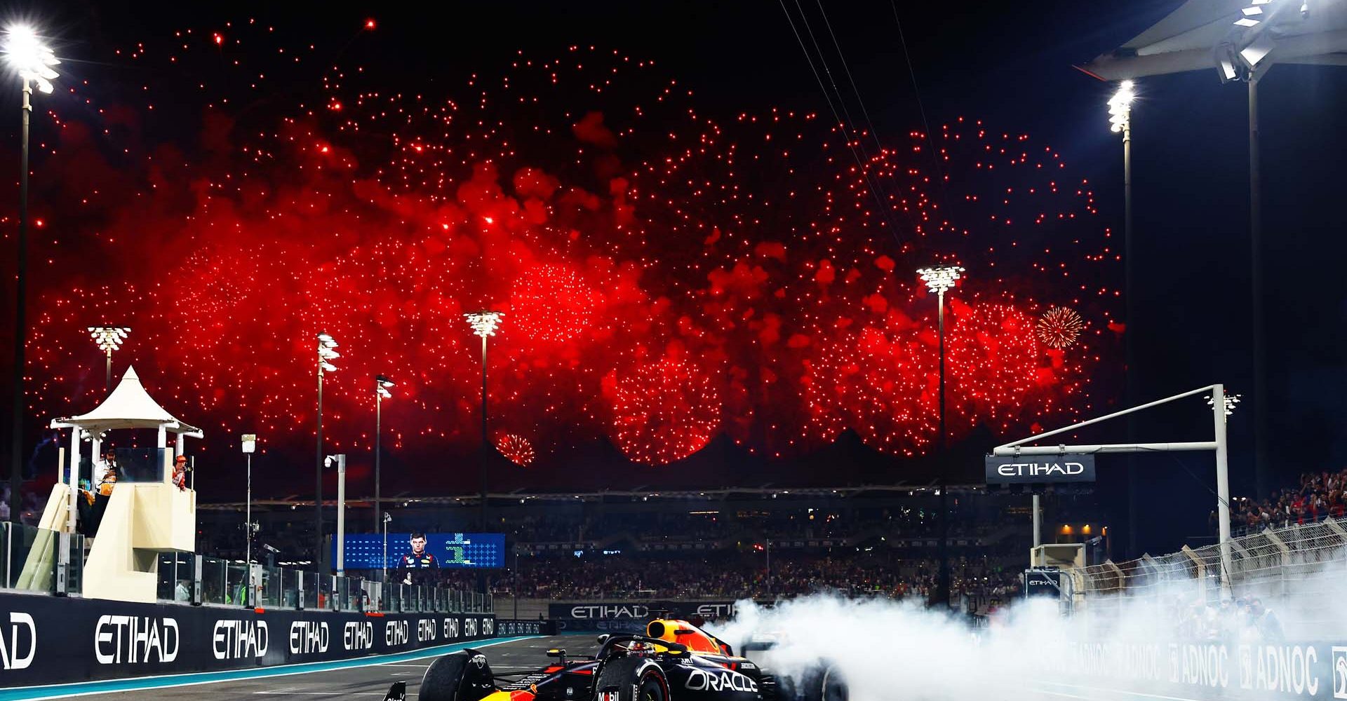 ABU DHABI, UNITED ARAB EMIRATES - NOVEMBER 26: Race winner Max Verstappen of the Netherlands driving the (1) Oracle Red Bull Racing RB19 performs donuts on track during the F1 Grand Prix of Abu Dhabi at Yas Marina Circuit on November 26, 2023 in Abu Dhabi, United Arab Emirates. (Photo by Mark Thompson/Getty Images) // Getty Images / Red Bull Content Pool // SI202311260254 // Usage for editorial use only //