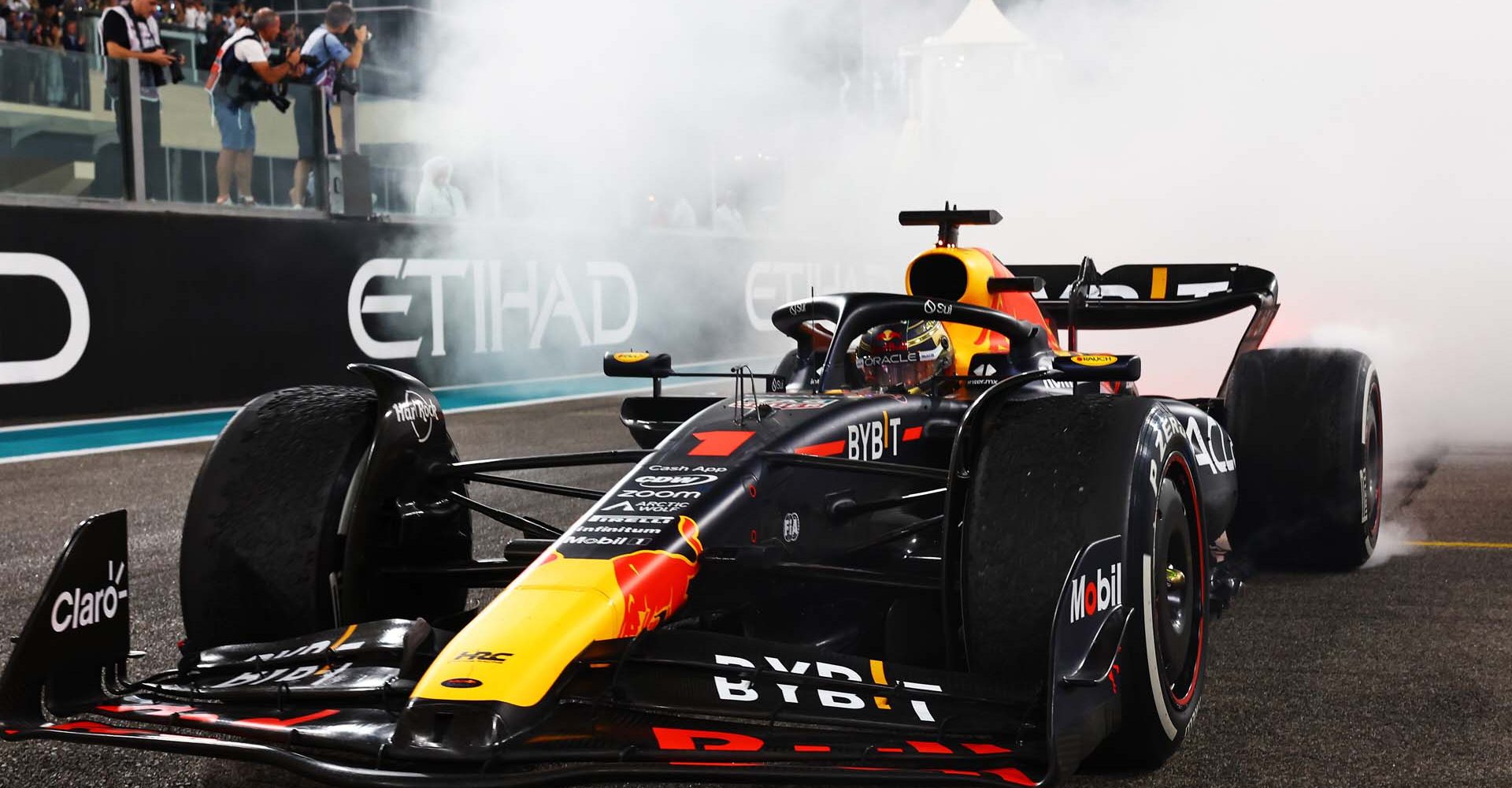 ABU DHABI, UNITED ARAB EMIRATES - NOVEMBER 26: Race winner Max Verstappen of the Netherlands driving the (1) Oracle Red Bull Racing RB19 performs donuts on track during the F1 Grand Prix of Abu Dhabi at Yas Marina Circuit on November 26, 2023 in Abu Dhabi, United Arab Emirates. (Photo by Mark Thompson/Getty Images) // Getty Images / Red Bull Content Pool // SI202311260255 // Usage for editorial use only //