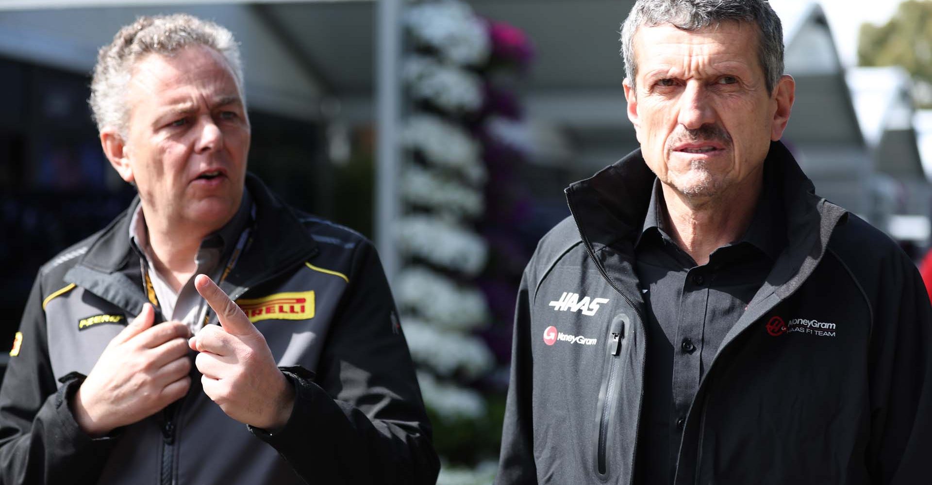 MELBOURNE GRAND PRIX CIRCUIT, AUSTRALIA - APRIL 02: Mario Isola, Racing Manager, Pirelli Motorsport Guenther Steiner, Team Principal, Haas F1 Team during the Australian GP at Melbourne Grand Prix Circuit on Sunday April 02, 2023 in Melbourne, Australia. (Photo by Lionel Ng / LAT Images)