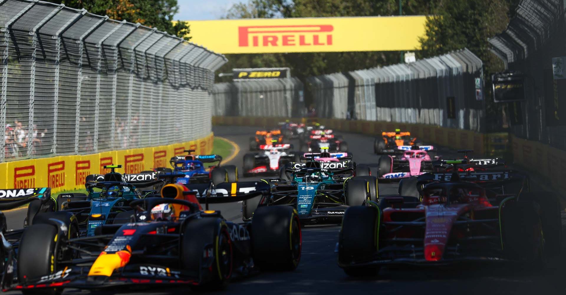 MELBOURNE GRAND PRIX CIRCUIT, AUSTRALIA - APRIL 02: Max Verstappen, Red Bull Racing RB19, leads Carlos Sainz, Ferrari SF-23, Fernando Alonso, Aston Martin AMR23, Lance Stroll, Aston Martin AMR23, and the remainder of the field during the Australian GP at Melbourne Grand Prix Circuit on Sunday April 02, 2023 in Melbourne, Australia. (Photo by Lionel Ng / LAT Images)