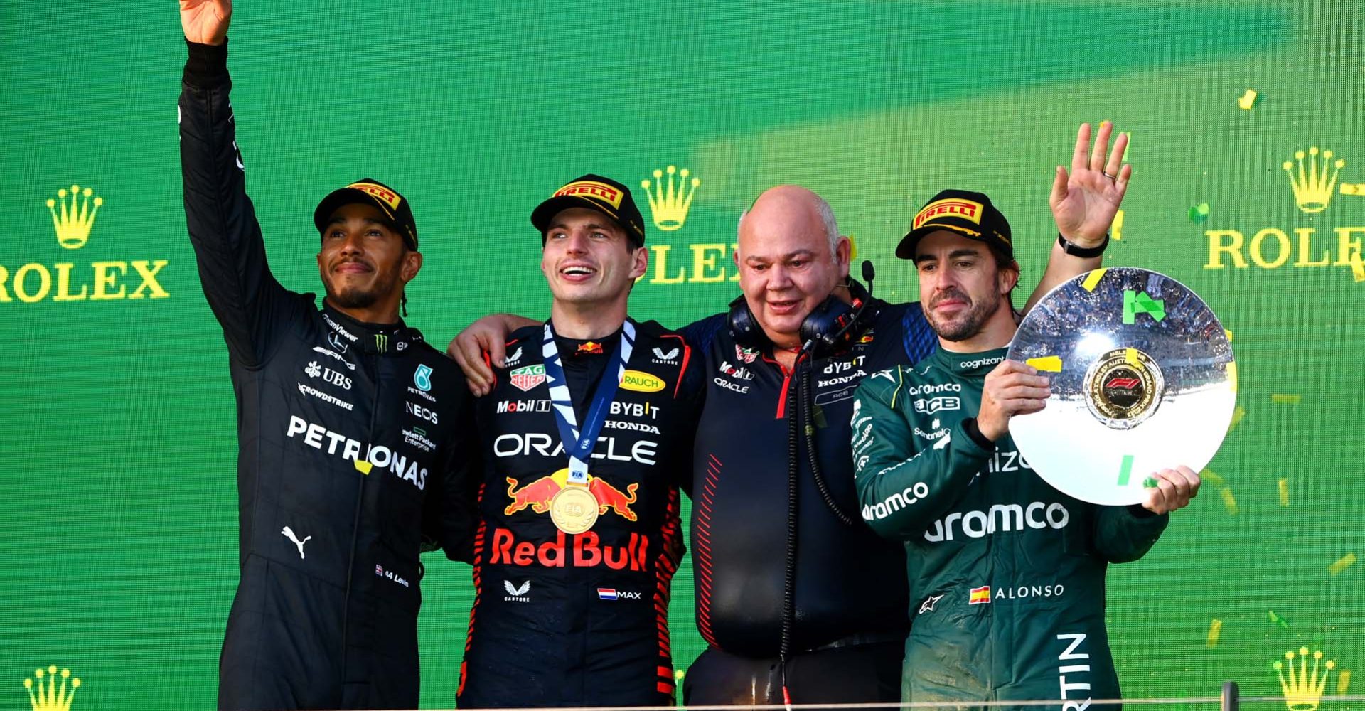 MELBOURNE, AUSTRALIA - APRIL 02: Race winner Max Verstappen of the Netherlands and Oracle Red Bull Racing (second from left), Second placed Lewis Hamilton of Great Britain and Mercedes (L), Third placed Fernando Alonso of Spain and Aston Martin F1 Team (R) and Rob Marshall, the Chief Engineering Officer of Red Bull Racing (second from right) celebrate on the podium during the F1 Grand Prix of Australia at Albert Park Grand Prix Circuit on April 02, 2023 in Melbourne, Australia. (Photo by Quinn Rooney/Getty Images)