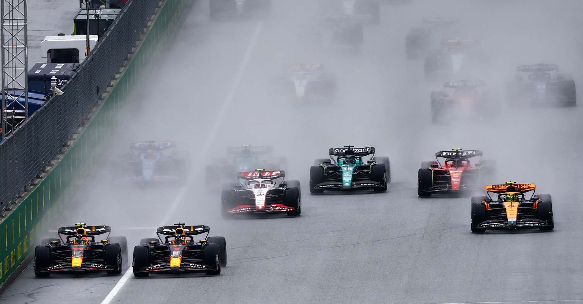 SPIELBERG, AUSTRIA - JULY 01: Max Verstappen of the Netherlands driving the (1) Oracle Red Bull Racing RB19 and Sergio Perez of Mexico driving the (11) Oracle Red Bull Racing RB19 battle for track position at the start during the Sprint ahead of the F1 Grand Prix of Austria at Red Bull Ring on July 01, 2023 in Spielberg, Austria. (Photo by Mark Thompson/Getty Images)