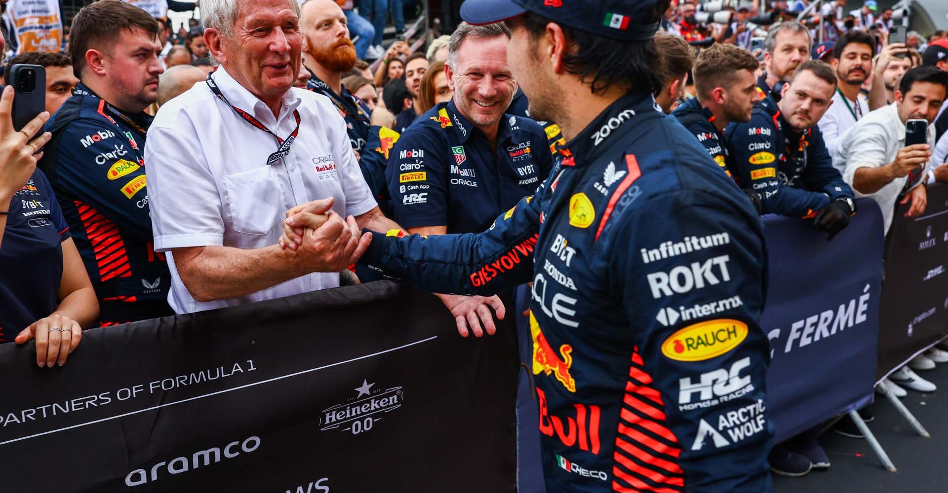 BAKU, AZERBAIJAN - APRIL 30: Race winner Sergio Perez of Mexico and Oracle Red Bull Racing celebrates with Red Bull Racing Team Consultant Dr Helmut Marko in parc ferme during the F1 Grand Prix of Azerbaijan at Baku City Circuit on April 30, 2023 in Baku, Azerbaijan. (Photo by Mark Thompson/Getty Images)