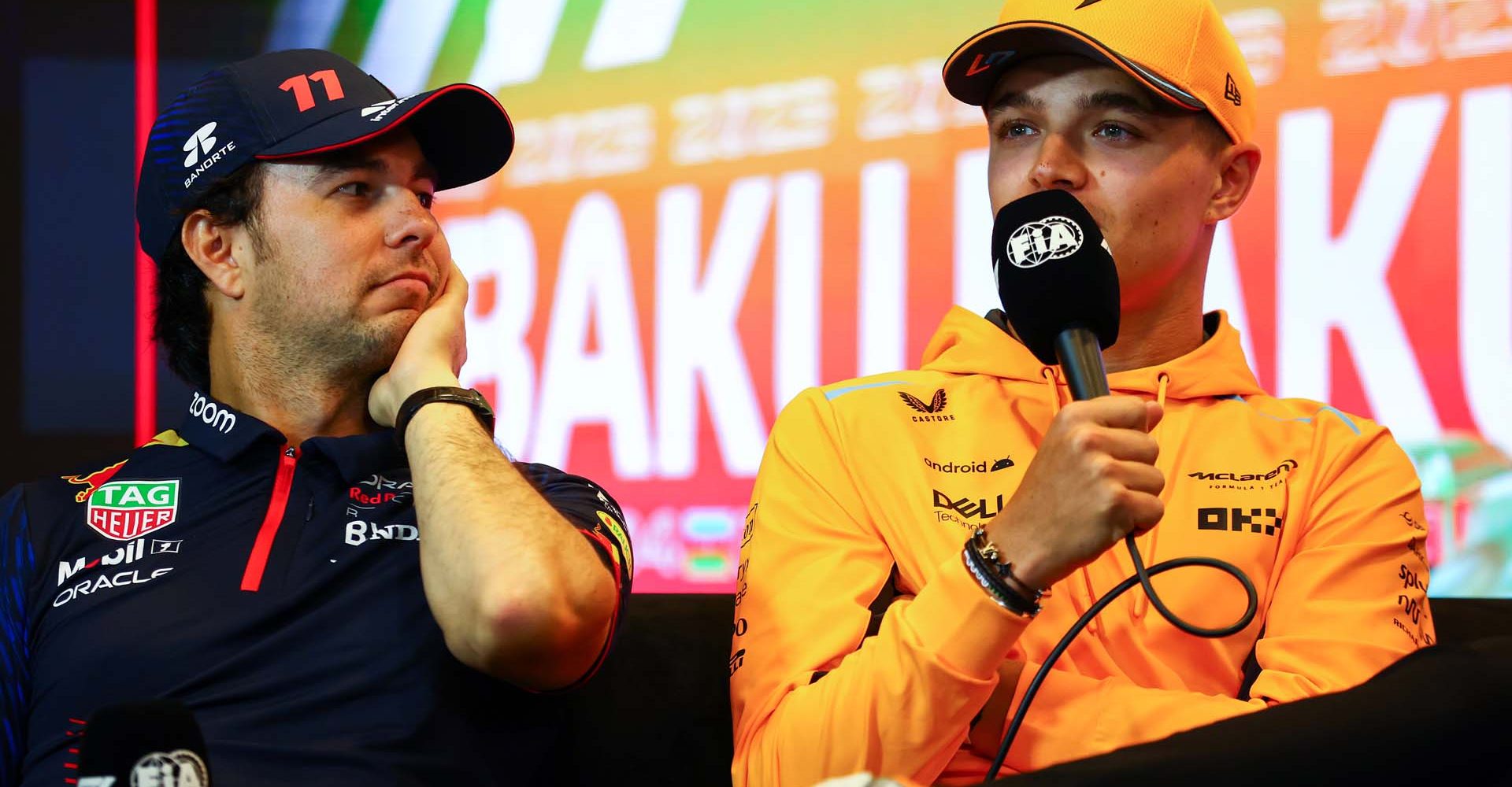 BAKU, AZERBAIJAN - APRIL 27: Lando Norris of Great Britain and McLaren and Sergio Perez of Mexico and Oracle Red Bull Racing  talk in a press conference during previews ahead of the F1 Grand Prix of Azerbaijan at Baku City Circuit on April 27, 2023 in Baku, Azerbaijan. (Photo by Bryn Lennon/Getty Images)