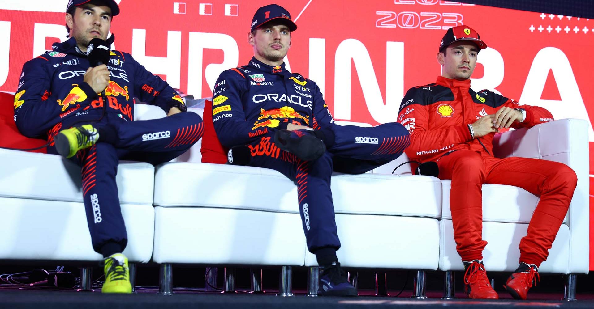 BAHRAIN, BAHRAIN - MARCH 04: Pole position qualifier Max Verstappen of the Netherlands and Oracle Red Bull Racing (C), Second placed qualifier Sergio Perez of Mexico and Oracle Red Bull Racing (L) and Third placed qualifier Charles Leclerc of Monaco and Ferrari (R) attend the press conference after qualifying ahead of the F1 Grand Prix of Bahrain at Bahrain International Circuit on March 04, 2023 in Bahrain, Bahrain. (Photo by Dan Istitene/Getty Images)