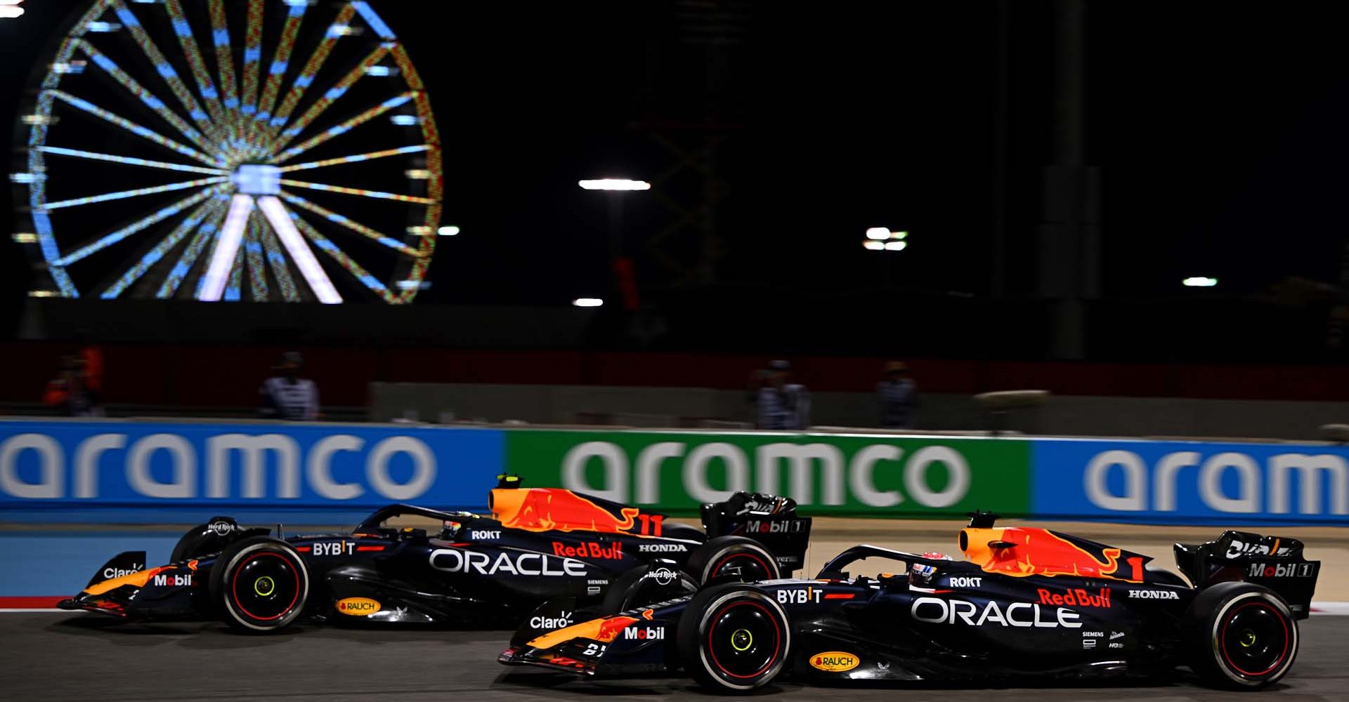 BAHRAIN, BAHRAIN - MARCH 05: Race winner Max Verstappen of the Netherlands driving the (1) Oracle Red Bull Racing RB19 and Second placed Sergio Perez of Mexico driving the (11) Oracle Red Bull Racing RB19 during the F1 Grand Prix of Bahrain at Bahrain International Circuit on March 05, 2023 in Bahrain, Bahrain. (Photo by Clive Mason/Getty Images)