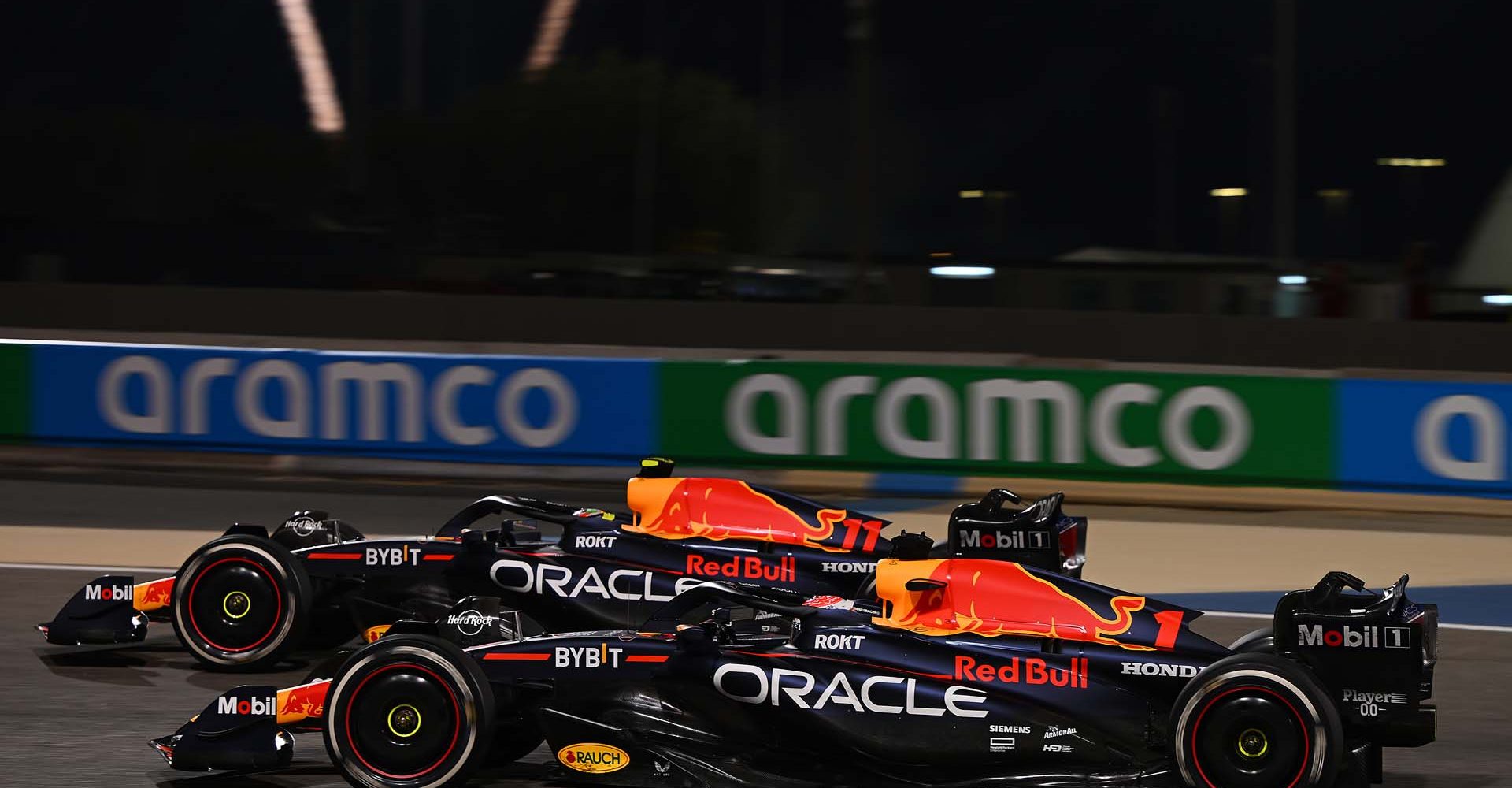 BAHRAIN, BAHRAIN - MARCH 05: Race winner Max Verstappen of the Netherlands driving the (1) Oracle Red Bull Racing RB19 and Second placed Sergio Perez of Mexico driving the (11) Oracle Red Bull Racing RB19 during the F1 Grand Prix of Bahrain at Bahrain International Circuit on March 05, 2023 in Bahrain, Bahrain. (Photo by Clive Mason/Getty Images)