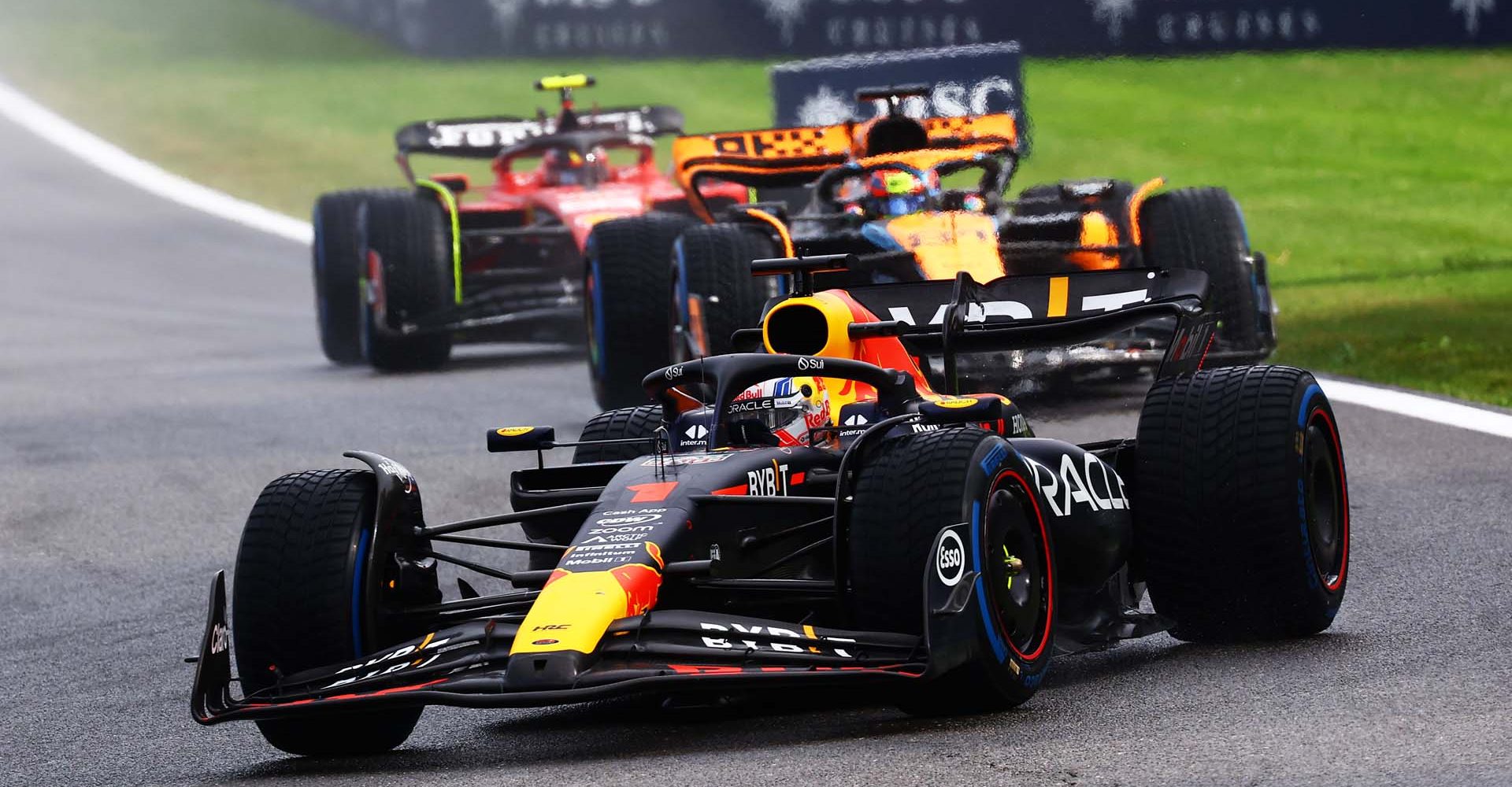 SPA, BELGIUM - JULY 29: Max Verstappen of the Netherlands driving the (1) Oracle Red Bull Racing RB19 leads Oscar Piastri of Australia driving the (81) McLaren MCL60 Mercedes and the rest of the field during the Sprint ahead of the F1 Grand Prix of Belgium at Circuit de Spa-Francorchamps on July 29, 2023 in Spa, Belgium. (Photo by Mark Thompson/Getty Images)