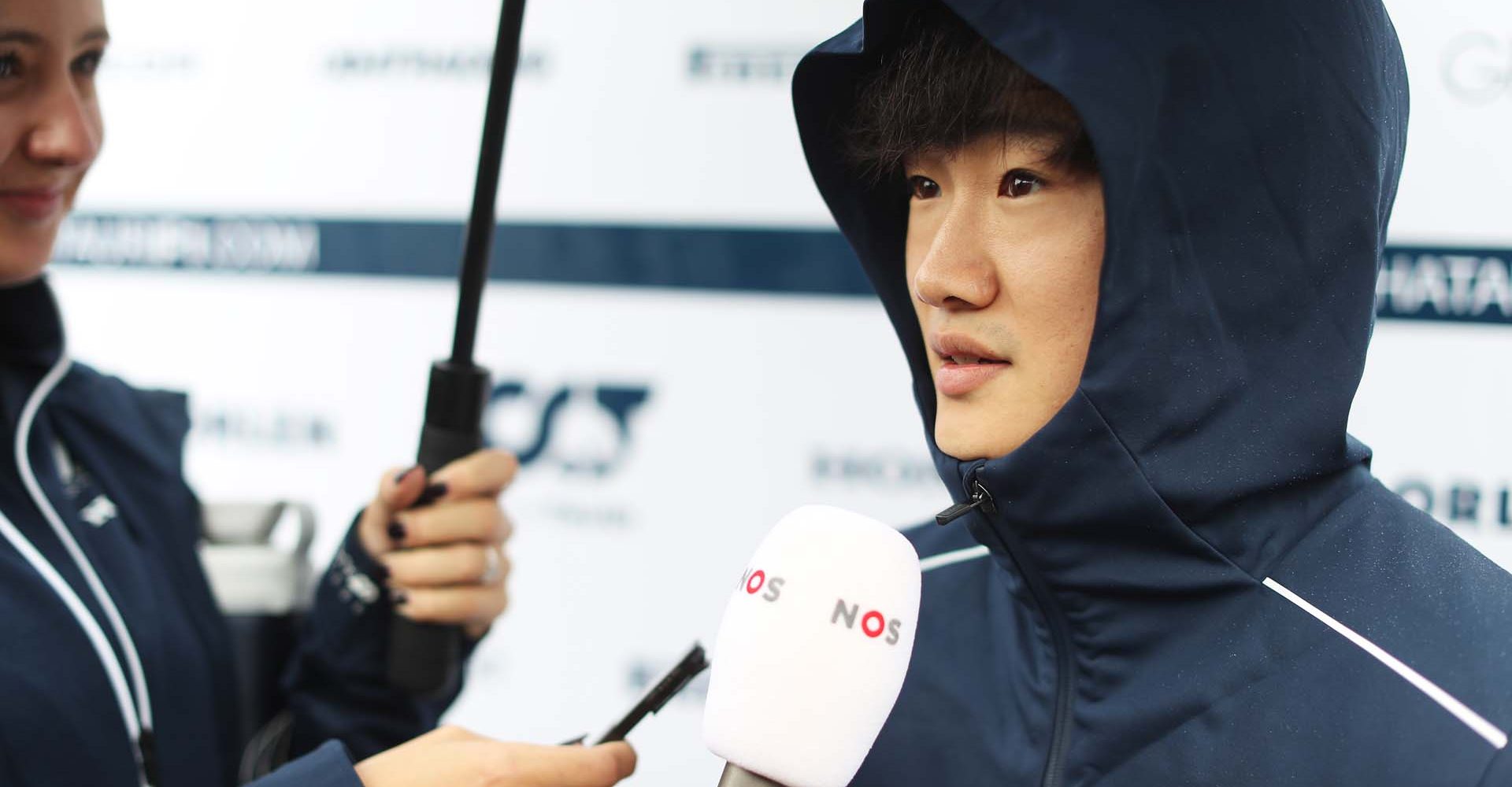 SPA, BELGIUM - JULY 27: Yuki Tsunoda of Japan and Scuderia AlphaTauri talks to the media in the Paddock during previews ahead of the F1 Grand Prix of Belgium at Circuit de Spa-Francorchamps on July 27, 2023 in Spa, Belgium. (Photo by Peter Fox/Getty Images)