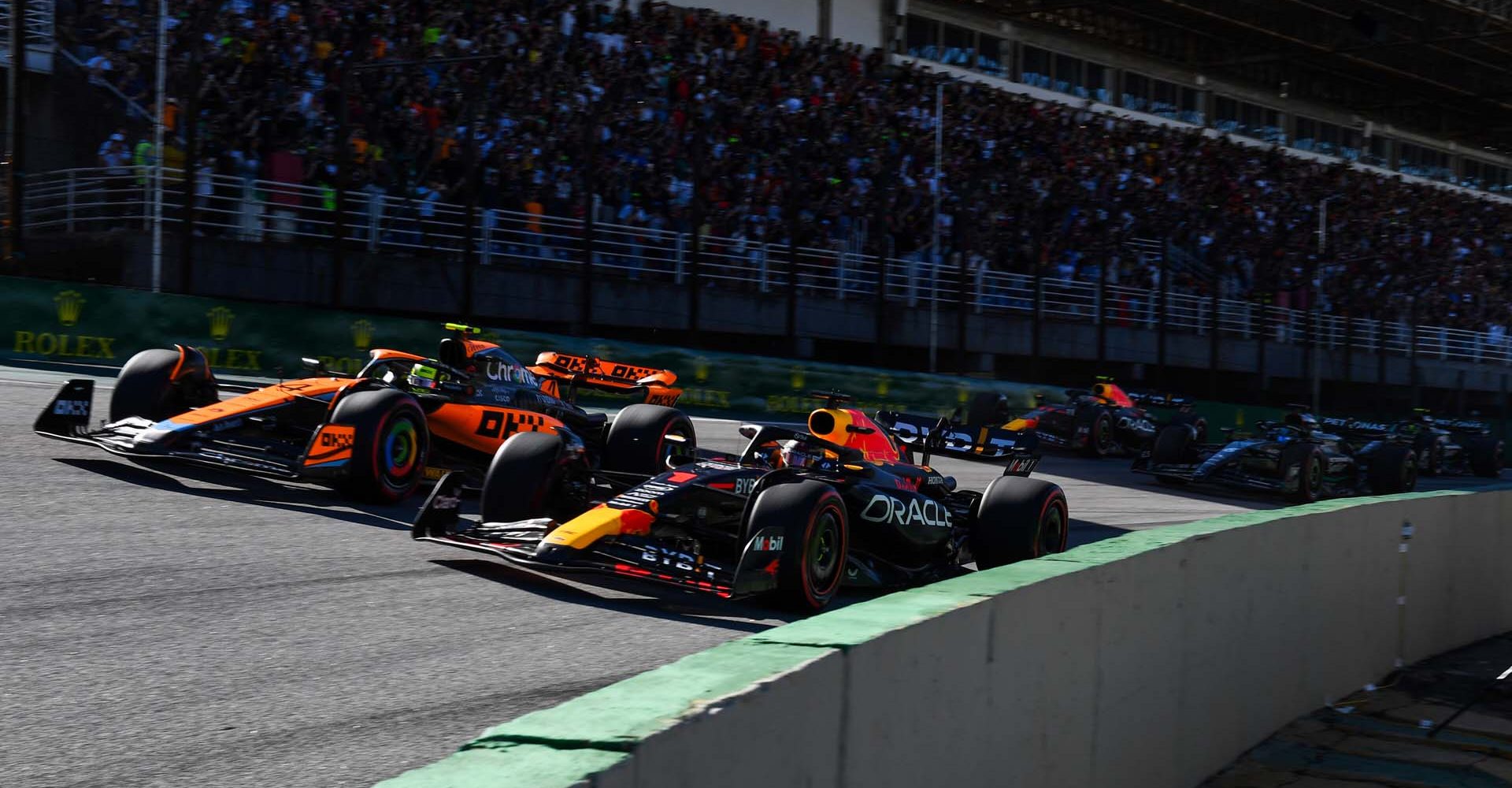 SAO PAULO, BRAZIL - NOVEMBER 04: Max Verstappen of the Netherlands driving the (1) Oracle Red Bull Racing RB19 leads Lando Norris of Great Britain driving the (4) McLaren MCL60 Mercedes on track during the Sprint ahead of the F1 Grand Prix of Brazil at Autodromo Jose Carlos Pace on November 04, 2023 in Sao Paulo, Brazil. (Photo by Rudy Carezzevoli/Getty Images) // Getty Images / Red Bull Content Pool // SI202311040516 // Usage for editorial use only //