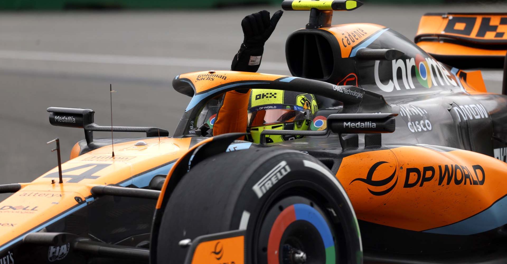 Lando Norris, McLaren MCL60, waves to fans on his way to Parc Ferme