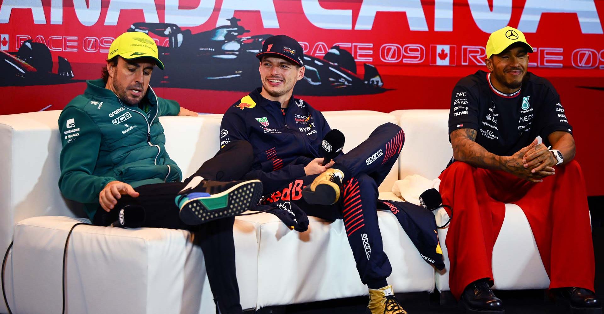 MONTREAL, QUEBEC - JUNE 18: Second placed Fernando Alonso of Spain and Aston Martin F1 Team and Race winner Max Verstappen of the Netherlands and Oracle Red Bull Racing and Third placed Lewis Hamilton of Great Britain and Mercedes talk during a press conference following the F1 Grand Prix of Canada at Circuit Gilles Villeneuve on June 18, 2023 in Montreal, Quebec. (Photo by Clive Mason/Getty Images)