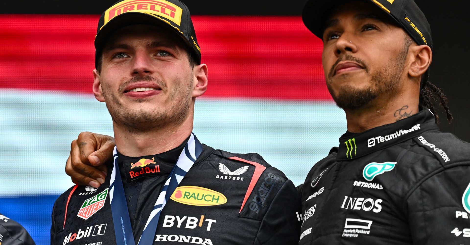 MONTREAL, QUEBEC - JUNE 18: Race winner Max Verstappen of the Netherlands and Oracle Red Bull Racing and Third placed Lewis Hamilton of Great Britain and Mercedes celebrate on the podium during the F1 Grand Prix of Canada at Circuit Gilles Villeneuve on June 18, 2023 in Montreal, Quebec. (Photo by Minas Panagiotakis/Getty Images)