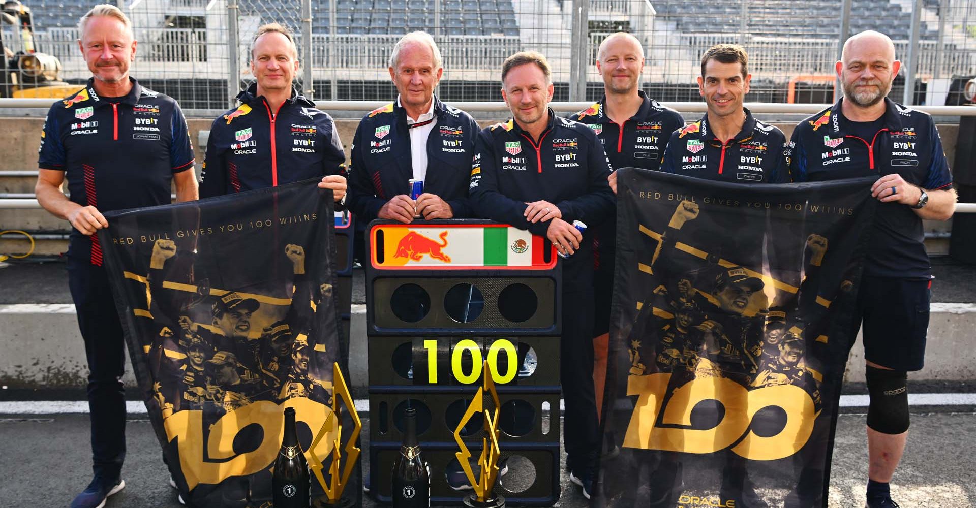 MONTREAL, QUEBEC - JUNE 18: The seven team members of the Red Bull Racing team that have been present for all 100 race wins, (L-R) Red Bull Racing Team Manager Jonathan Wheatley, Red Bull Racing Head of Car Engineering Paul Monaghan, Red Bull Racing Team Consultant Dr Helmut Marko, Red Bull Racing Team Principal Christian Horner, Ole Schack, mechanic at Red Bull Racing, Chris Gent, mechanic at Red Bull Racing and Richard Tomlinson of Red Bull Racing, pose for a photo after the F1 Grand Prix of Canada at Circuit Gilles Villeneuve on June 18, 2023 in Montreal, Quebec. (Photo by Dan Mullan/Getty Images)