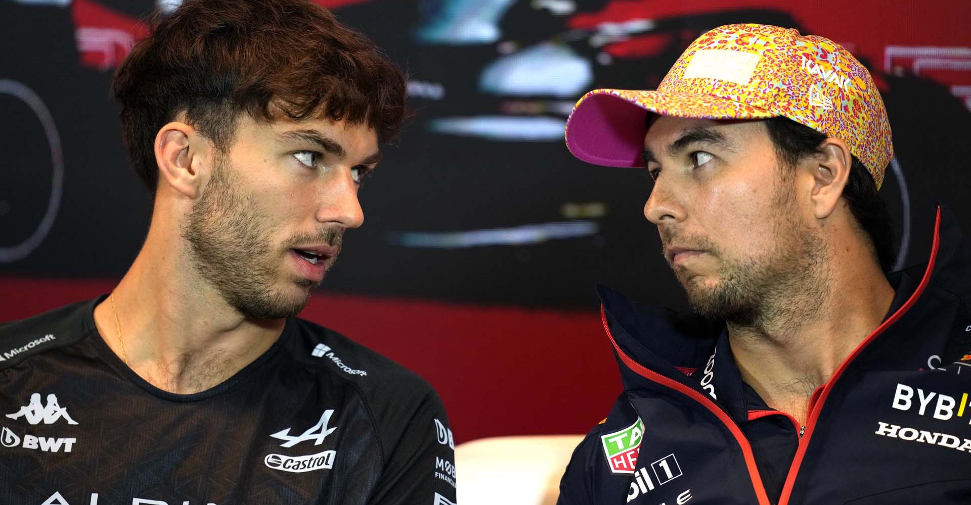 MONTREAL, QUEBEC - JUNE 15: Pierre Gasly of France and Alpine F1 and Sergio Perez of Mexico and Oracle Red Bull Racing talk in the Drivers Press Conference during previews ahead of the F1 Grand Prix of Canada at Circuit Gilles Villeneuve on June 15, 2023 in Montreal, Quebec. (Photo by Rudy Carezzevoli/Getty Images)