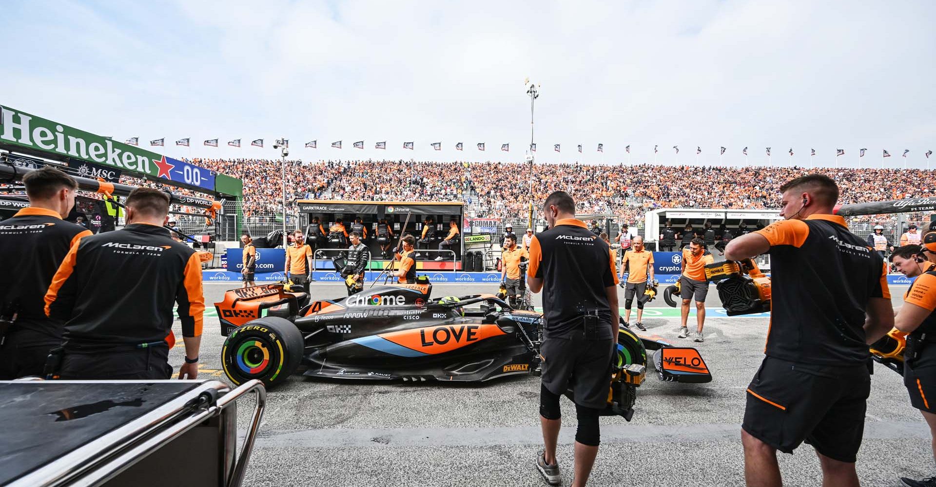 Lando Norris, McLaren MCL60, in the pit lane