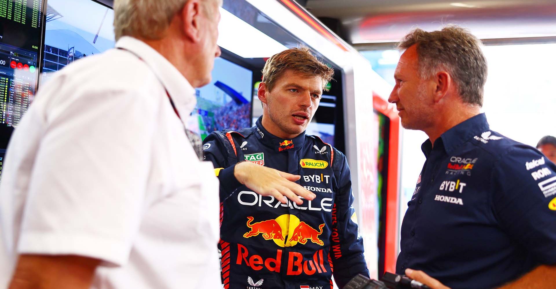 ZANDVOORT, NETHERLANDS - AUGUST 25: Max Verstappen of the Netherlands and Oracle Red Bull Racing talks with Red Bull Racing Team Principal Christian Horner and Red Bull Racing Team Consultant Dr Helmut Marko in the garage during practice ahead of the F1 Grand Prix of The Netherlands at Circuit Zandvoort on August 25, 2023 in Zandvoort, Netherlands. (Photo by Mark Thompson/Getty Images)