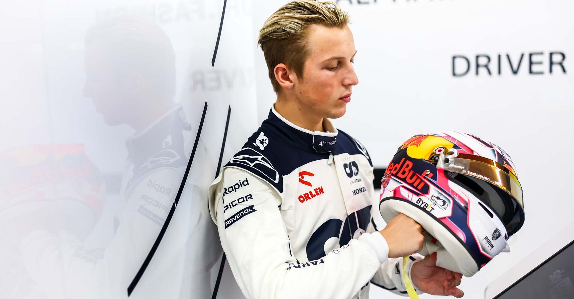 ZANDVOORT, NETHERLANDS - AUGUST 25: Liam Lawson of New Zealand and Scuderia AlphaTauri looks on in the garage after practice ahead of the F1 Grand Prix of The Netherlands at Circuit Zandvoort on August 25, 2023 in Zandvoort, Netherlands. (Photo by Mark Thompson/Getty Images)