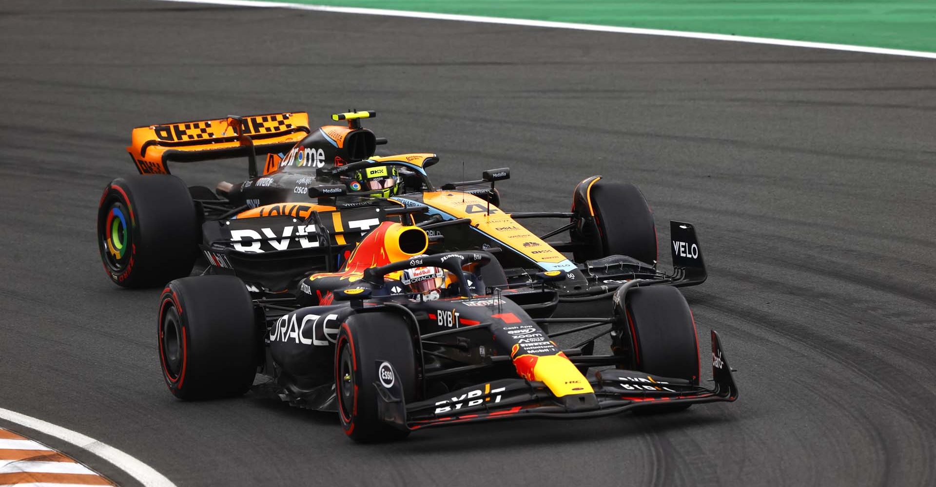 CIRCUIT ZANDVOORT, NETHERLANDS - AUGUST 27: Max Verstappen, Red Bull Racing RB19, leads Lando Norris, McLaren MCL60 during the Dutch GP at Circuit Zandvoort on Sunday August 27, 2023 in North Holland, Netherlands. (Photo by Andy Hone / LAT Images)