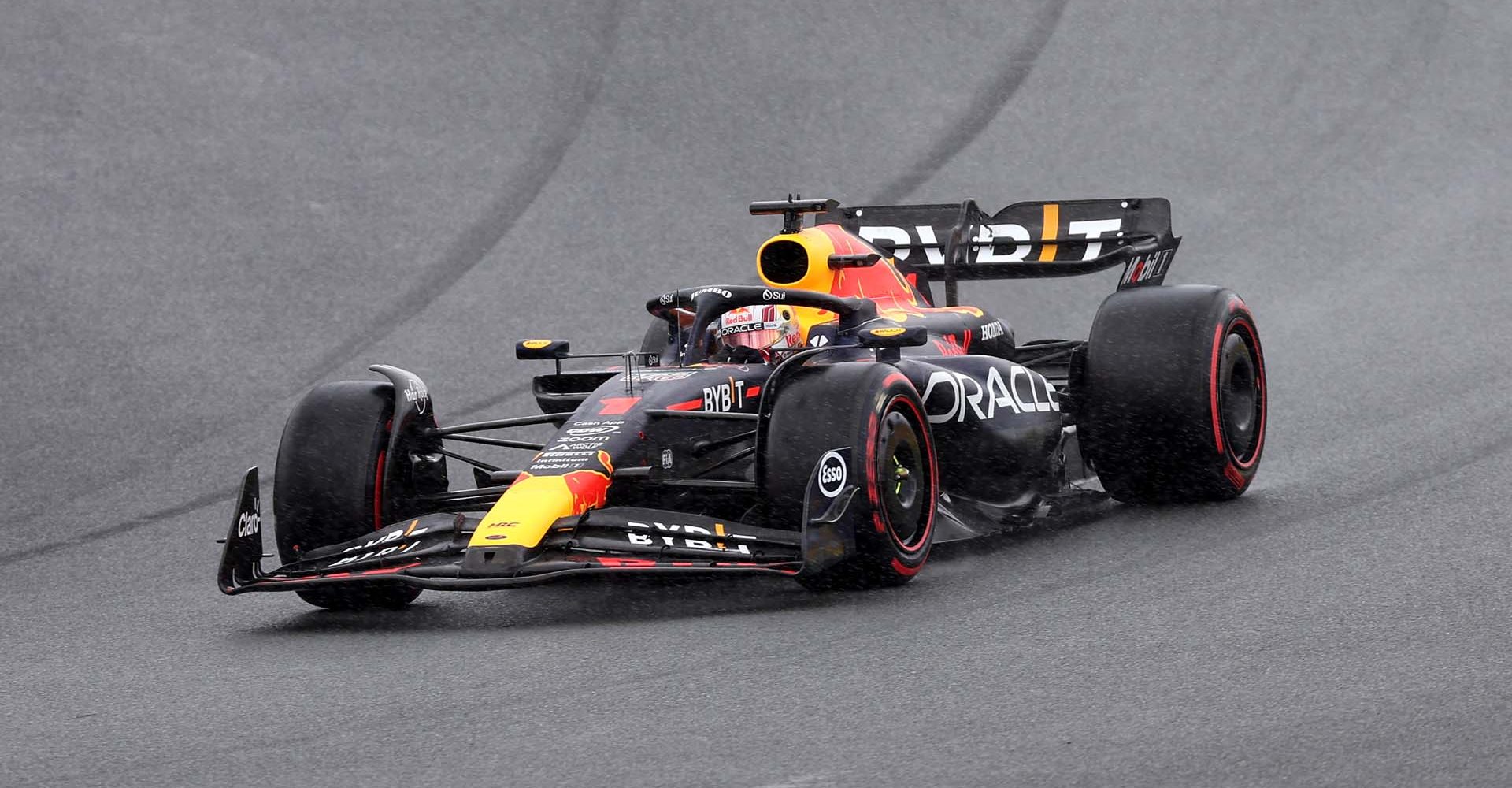 ZANDVOORT, NETHERLANDS - AUGUST 27: Max Verstappen of the Netherlands driving the (1) Oracle Red Bull Racing RB19 of Great Britain driving the (4) McLaren MCL60 Mercedes in the rain during the F1 Grand Prix of The Netherlands at Circuit Zandvoort on August 27, 2023 in Zandvoort, Netherlands. (Photo by Lars Baron/Getty Images)