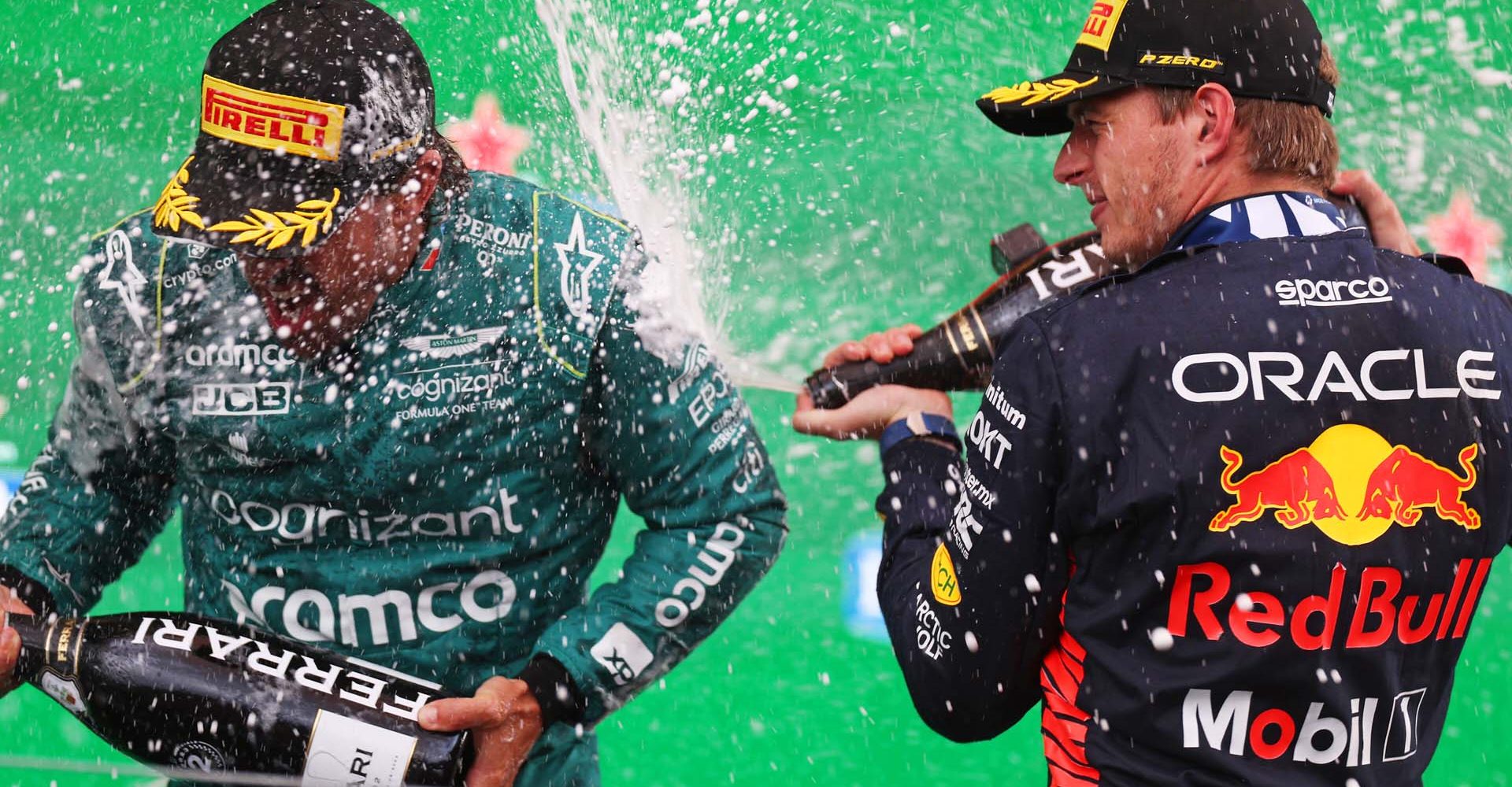 ZANDVOORT, NETHERLANDS - AUGUST 27: Race winner Max Verstappen of the Netherlands and Oracle Red Bull Racing and Second placed Fernando Alonso of Spain and Aston Martin F1 Team celebrate on the podium during the F1 Grand Prix of The Netherlands at Circuit Zandvoort on August 27, 2023 in Zandvoort, Netherlands. (Photo by Dean Mouhtaropoulos/Getty Images) // Getty Images / Red Bull Content Pool // SI202308270757 // Usage for editorial use only //