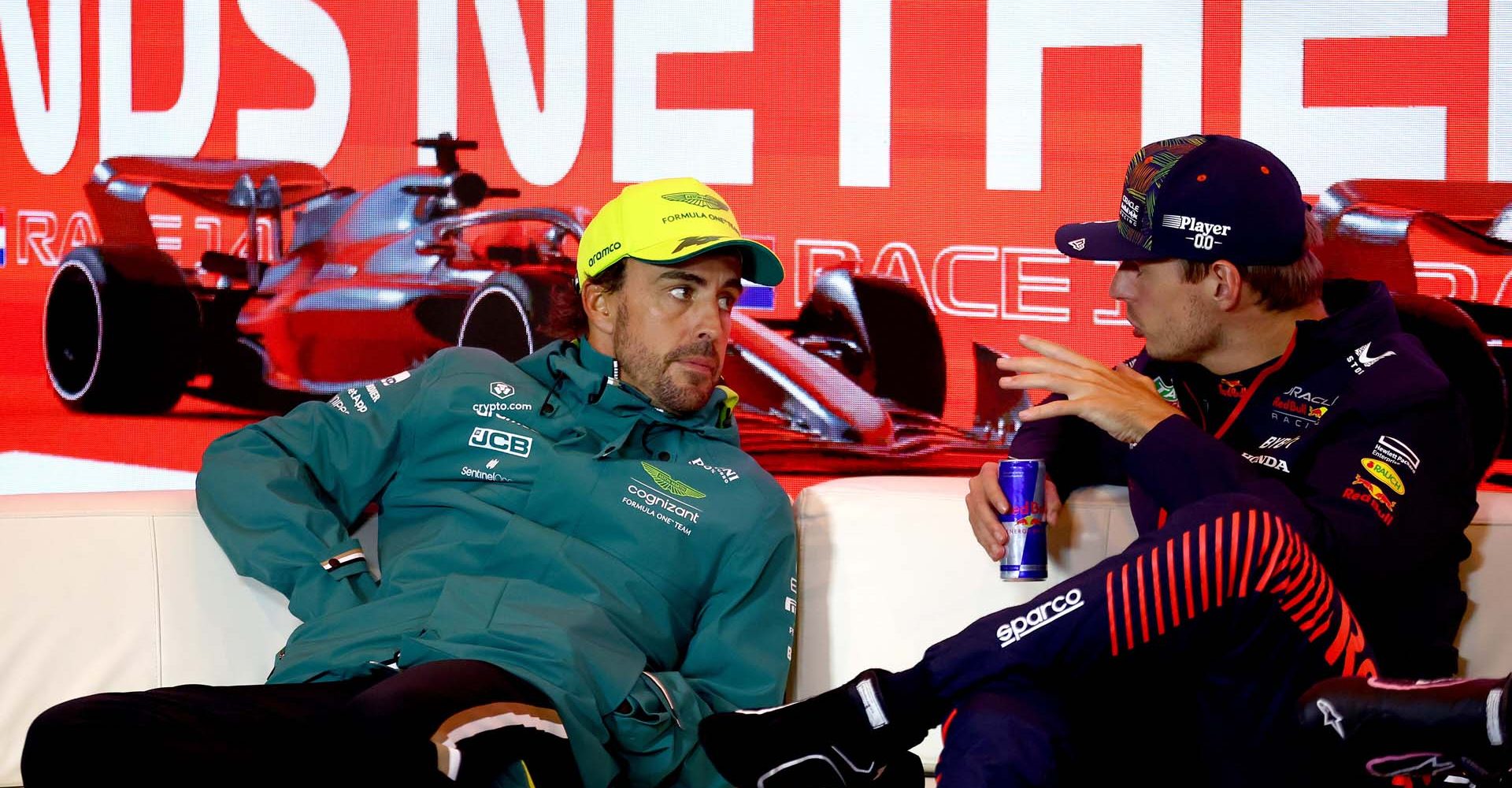 ZANDVOORT, NETHERLANDS - AUGUST 27: Race winner Max Verstappen of the Netherlands and Oracle Red Bull Racing and Second placed Fernando Alonso of Spain and Aston Martin F1 Team talk in the press conference after the F1 Grand Prix of The Netherlands at Circuit Zandvoort on August 27, 2023 in Zandvoort, Netherlands. (Photo by Bryn Lennon/Getty Images) // Getty Images / Red Bull Content Pool // SI202308270939 // Usage for editorial use only //