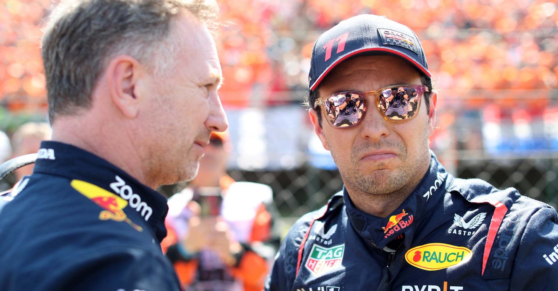 BUDAPEST, HUNGARY - JULY 23: Sergio Perez of Mexico and Oracle Red Bull Racing talks with Red Bull Racing Team Principal Christian Horner on the grid prior to the F1 Grand Prix of Hungary at Hungaroring on July 23, 2023 in Budapest, Hungary. (Photo by Peter Fox/Getty Images)