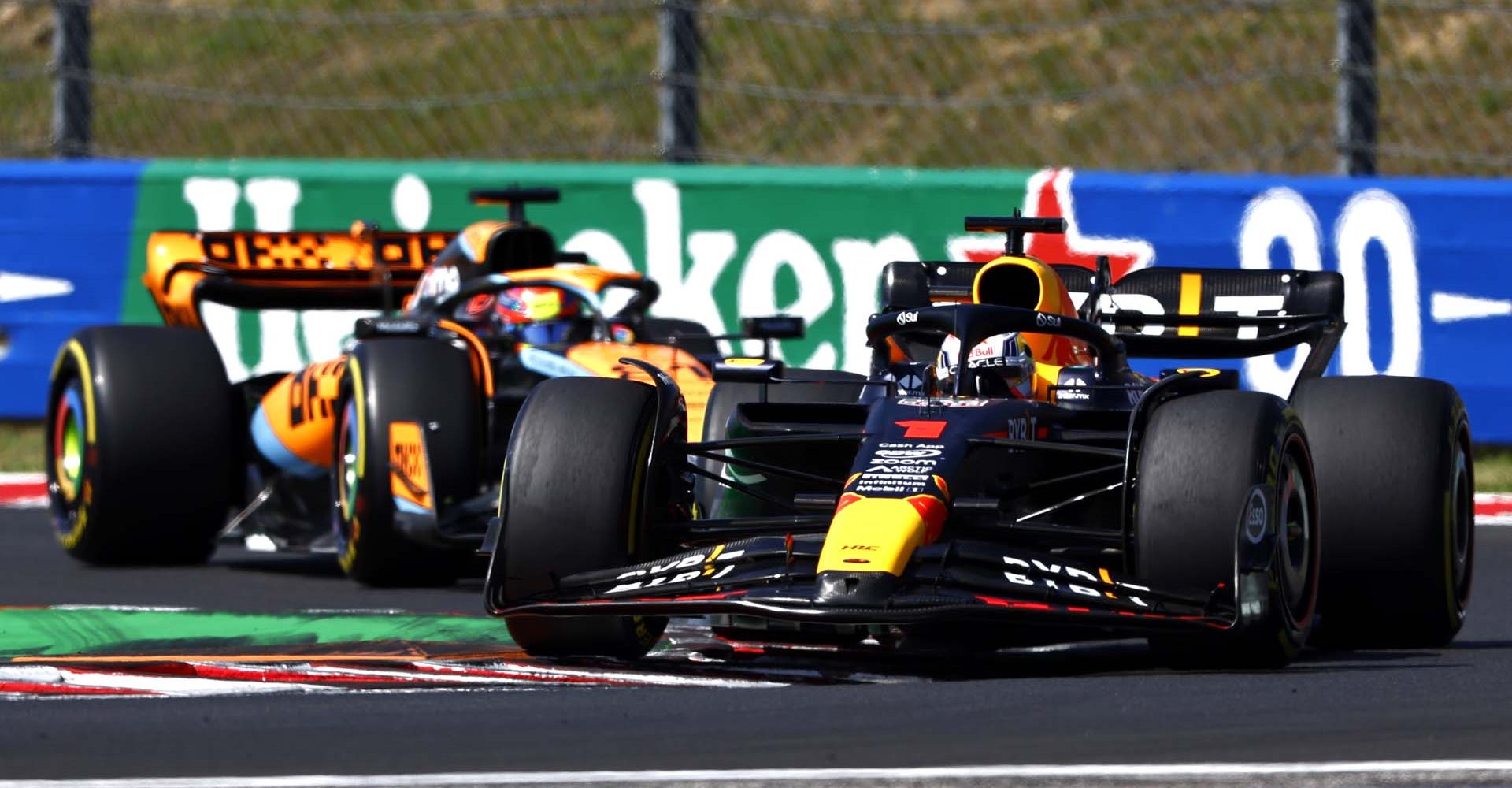 BUDAPEST, HUNGARY - JULY 23: Max Verstappen of the Netherlands driving the (1) Oracle Red Bull Racing RB19 leads Oscar Piastri of Australia driving the (81) McLaren MCL60 Mercedes during the F1 Grand Prix of Hungary at Hungaroring on July 23, 2023 in Budapest, Hungary. (Photo by Francois Nel/Getty Images)