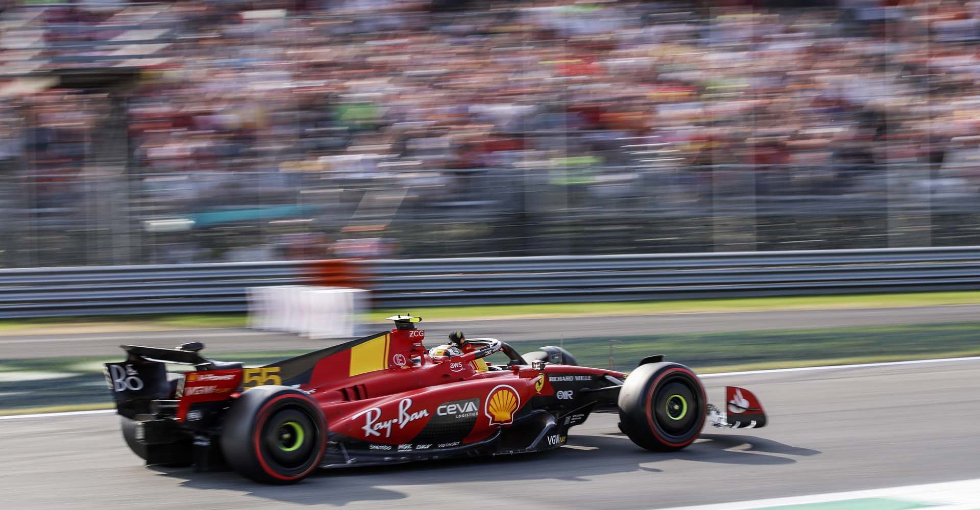 AUTODROMO NAZIONALE MONZA, ITALY - SEPTEMBER 02: Pole man Carlos Sainz, Ferrari SF-23, waves to fans on his way to Parc Ferme during the Italian GP at Autodromo Nazionale Monza on Saturday September 02, 2023 in Monza, Italy. (Photo by Jake Grant / LAT Images)