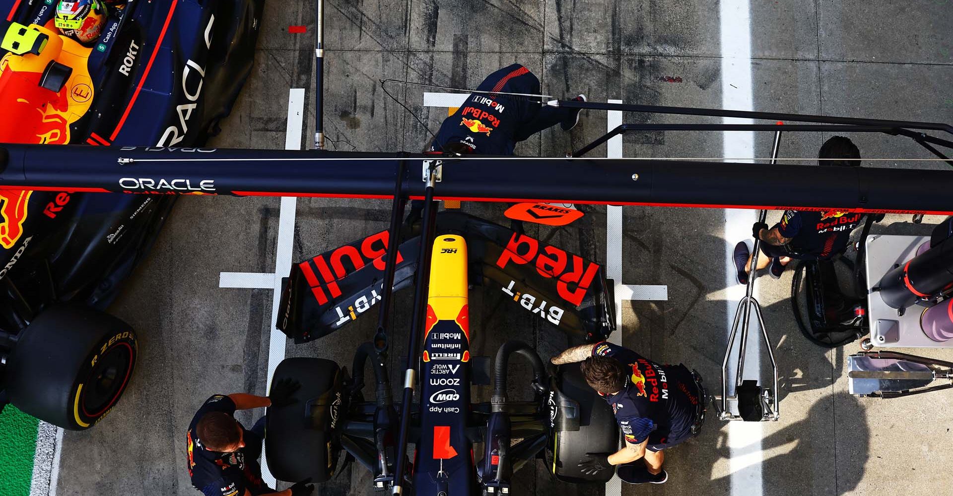 MONZA, ITALY - SEPTEMBER 02: Max Verstappen of the Netherlands driving the (1) Oracle Red Bull Racing RB19 and Sergio Perez of Mexico driving the (11) Oracle Red Bull Racing RB19 stop in the Pitlane during qualifying ahead of the F1 Grand Prix of Italy at Autodromo Nazionale Monza on September 02, 2023 in Monza, Italy. (Photo by Mark Thompson/Getty Images) // Getty Images / Red Bull Content Pool // SI202309020367 // Usage for editorial use only //