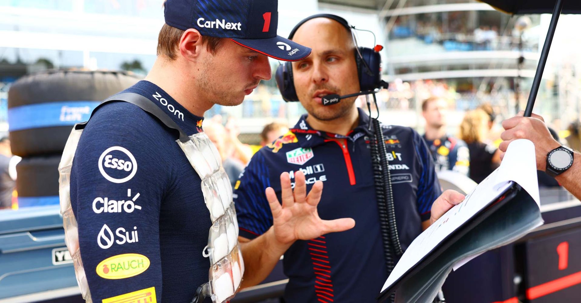 MONZA, ITALY - SEPTEMBER 03: Max Verstappen of the Netherlands and Oracle Red Bull Racing talks with race engineer Gianpiero Lambiase on the grid prior to the F1 Grand Prix of Italy at Autodromo Nazionale Monza on September 03, 2023 in Monza, Italy. (Photo by Mark Thompson/Getty Images) // Getty Images / Red Bull Content Pool // SI202309030236 // Usage for editorial use only //