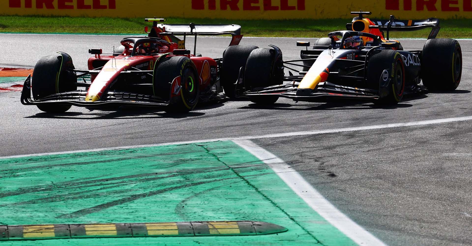 MONZA, ITALY - SEPTEMBER 03: Carlos Sainz of Spain driving (55) the Ferrari SF-23 and Max Verstappen of the Netherlands driving the (1) Oracle Red Bull Racing RB19 battle for track position during the F1 Grand Prix of Italy at Autodromo Nazionale Monza on September 03, 2023 in Monza, Italy. (Photo by Mark Thompson/Getty Images) // Getty Images / Red Bull Content Pool // SI202309030245 // Usage for editorial use only //