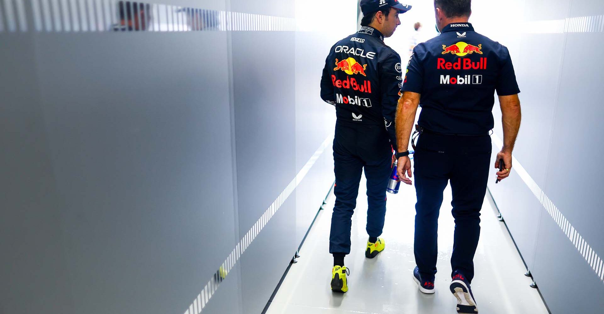 SUZUKA, JAPAN - SEPTEMBER 22: Sergio Perez of Mexico and Oracle Red Bull Racing talks with Red Bull Racing Team Principal Christian Horner in the garage during practice ahead of the F1 Grand Prix of Japan at Suzuka International Racing Course on September 22, 2023 in Suzuka, Japan. (Photo by Mark Thompson/Getty Images) // Getty Images / Red Bull Content Pool // SI202309220135 // Usage for editorial use only //