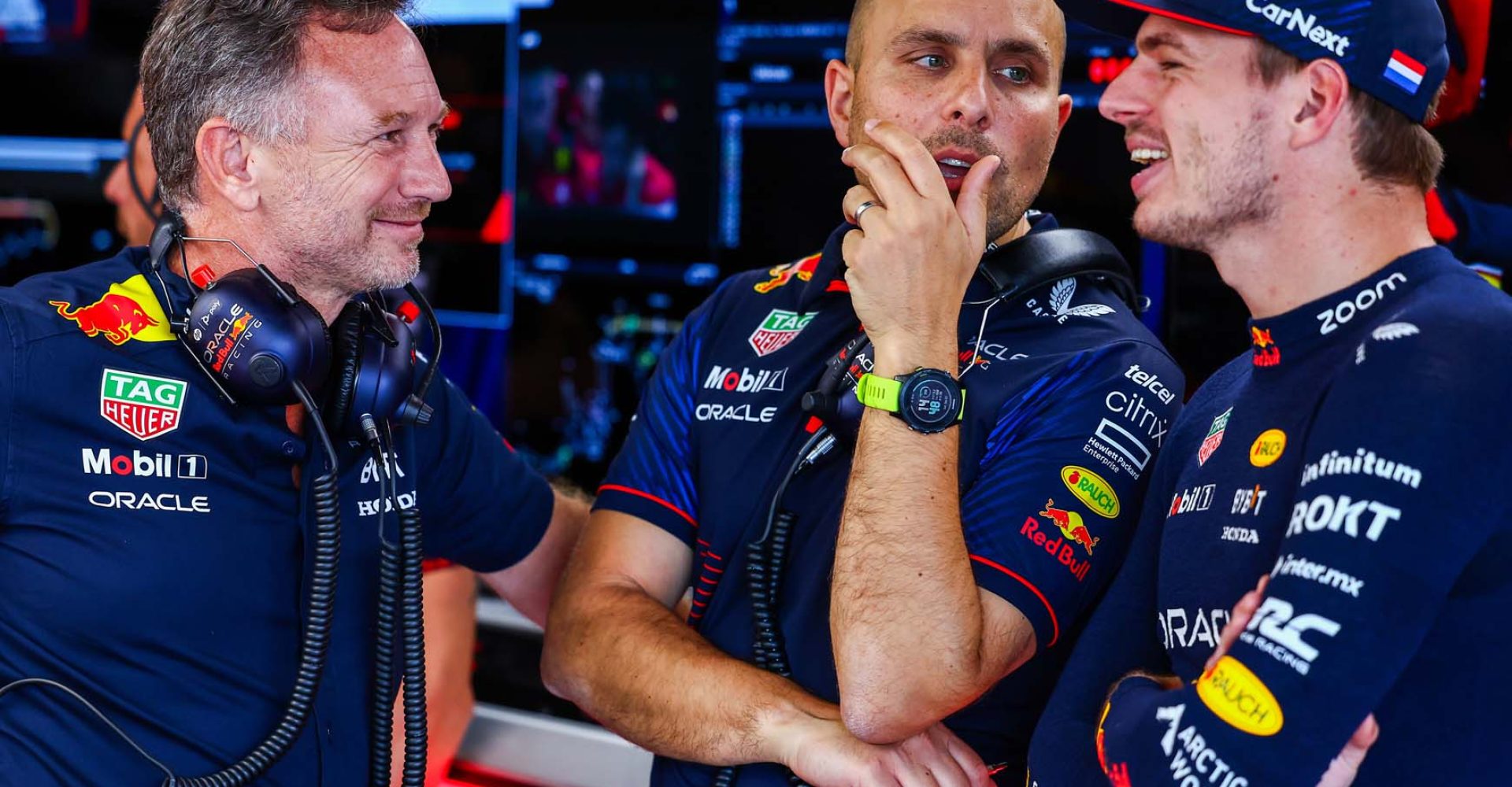 SUZUKA, JAPAN - SEPTEMBER 23: Red Bull Racing Team Principal Christian Horner talks with Max Verstappen of the Netherlands and Oracle Red Bull Racing and race engineer Gianpiero Lambiase in the garage during qualifying ahead of the F1 Grand Prix of Japan at Suzuka International Racing Course on September 23, 2023 in Suzuka, Japan. (Photo by Mark Thompson/Getty Images) // Getty Images / Red Bull Content Pool // SI202309230132 // Usage for editorial use only //