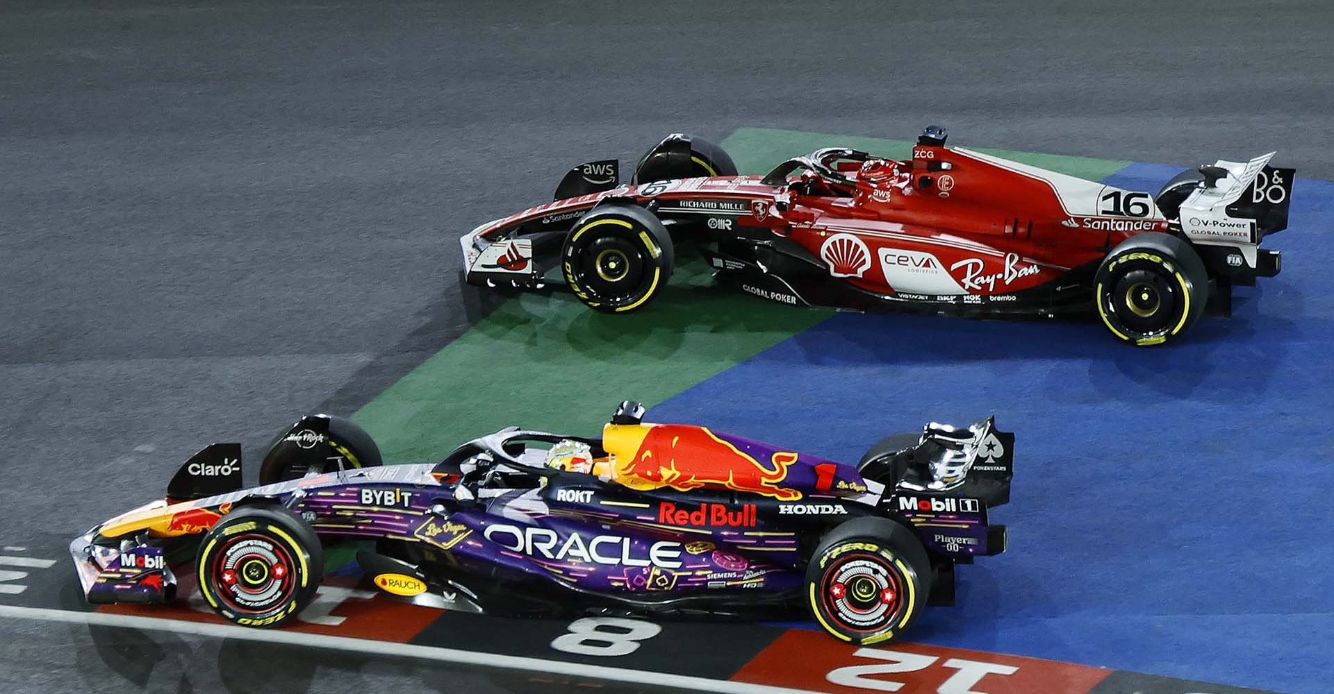 LAS VEGAS, NEVADA - NOVEMBER 18: Max Verstappen of the Netherlands driving the (1) Oracle Red Bull Racing RB19 leads Charles Leclerc of Monaco driving the (16) Ferrari SF-23 at turn one during the F1 Grand Prix of Las Vegas at Las Vegas Strip Circuit on November 18, 2023 in Las Vegas, Nevada. (Photo by Chris Graythen/Getty Images)