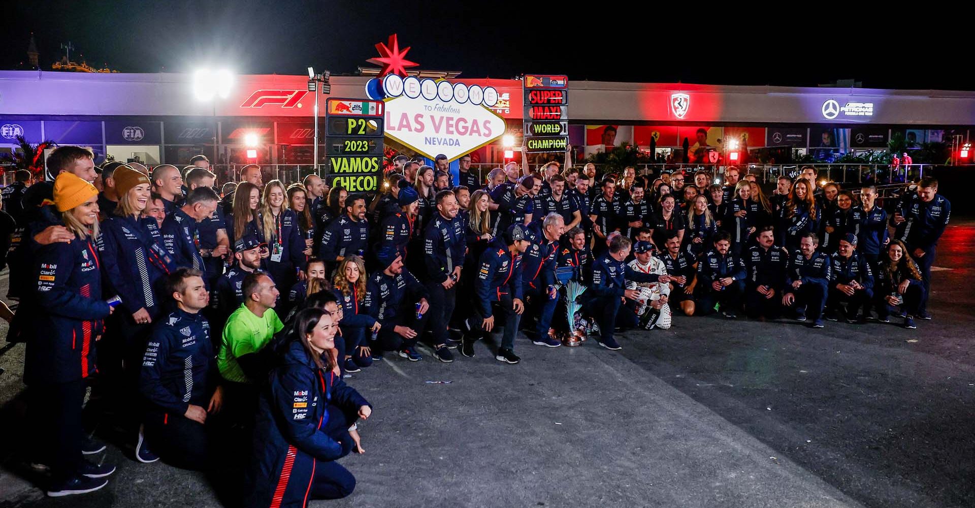 LAS VEGAS, NEVADA - NOVEMBER 18: Race winner Max Verstappen of the Netherlands and Oracle Red Bull Racing and Third placed Sergio Perez of Mexico and Oracle Red Bull Racing celebrate with their Red Bull Racing team in the Paddock after the F1 Grand Prix of Las Vegas at Las Vegas Strip Circuit on November 18, 2023 in Las Vegas, Nevada. (Photo by Chris Graythen/Getty Images) // Getty Images / Red Bull Content Pool // SI202311190308 // Usage for editorial use only //